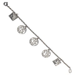 Antique Diamond and 14 Carat White Gold and Platinum Multi Charm Bracelet