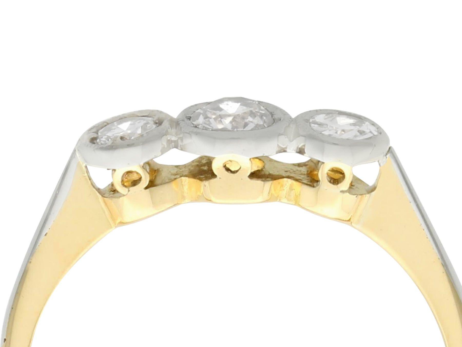 A fine and impressive antique 0.50 carat diamond and 18 karat yellow gold, platinum set trilogy ring; part of our diverse antique jewelry collections.

This fine and impressive collet set diamond trilogy ring has been crafted in 18k yellow gold with