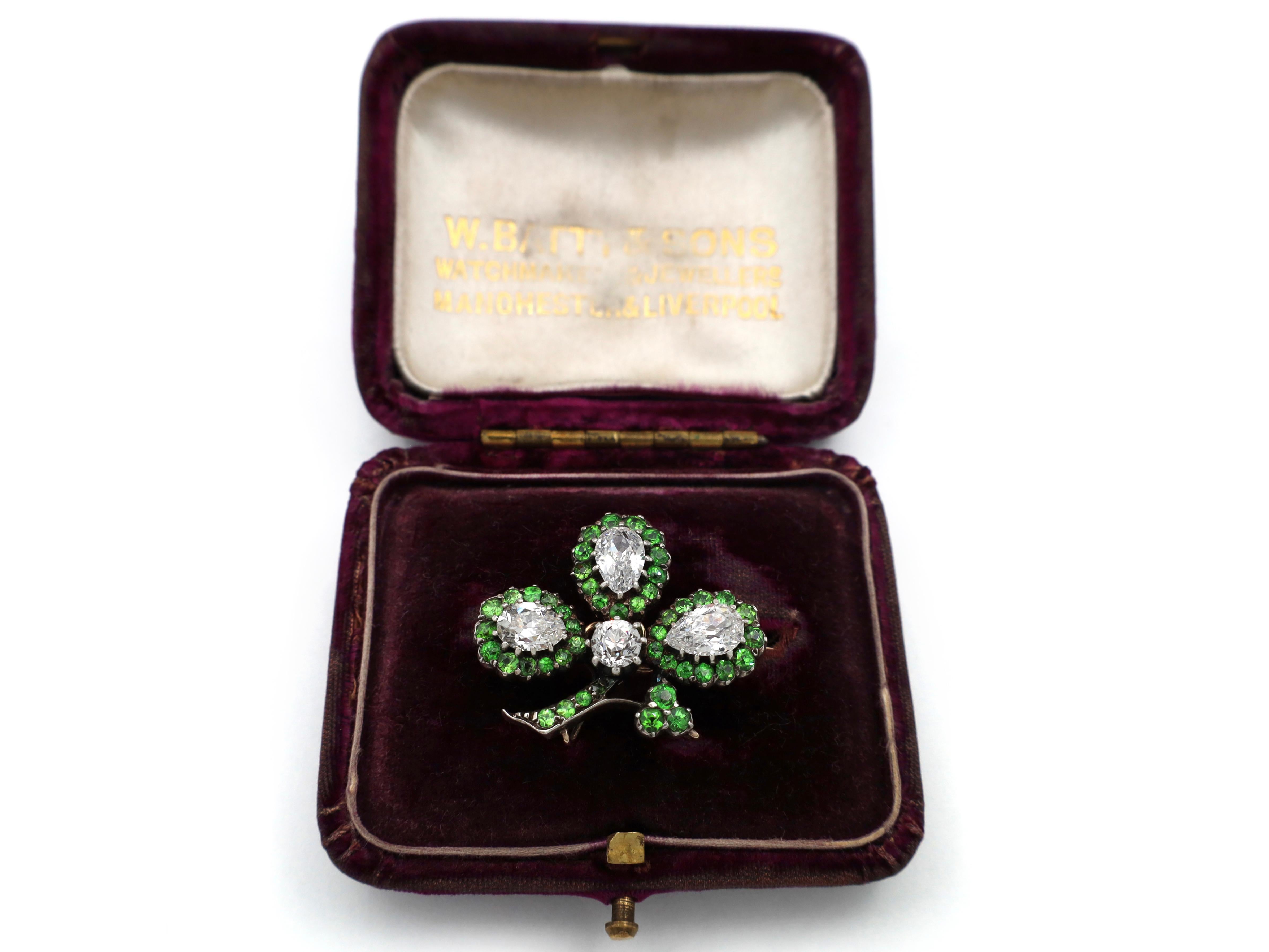 Pear Cut Antique diamond and demantoid garnet shamrock brooch in silver on gold For Sale