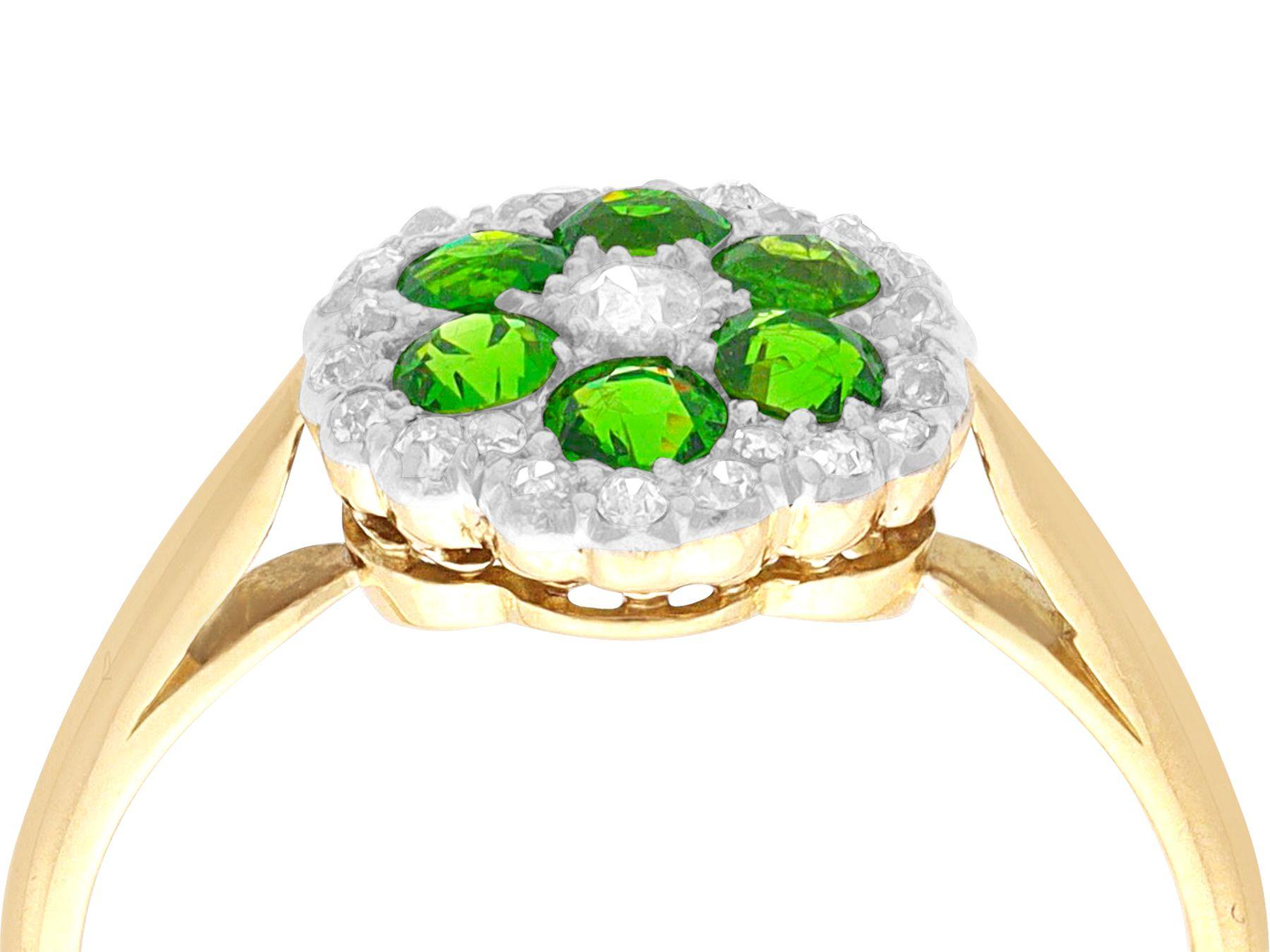 A stunning, fine and impressive antique 0.70 carat demantoid garnet and 0.31 carat diamond, 18 karat yellow gold and platinum set cocktail ring; part of our diverse range of gemstone jewelry.

This stunning, fine and impressive antique gemstone ring