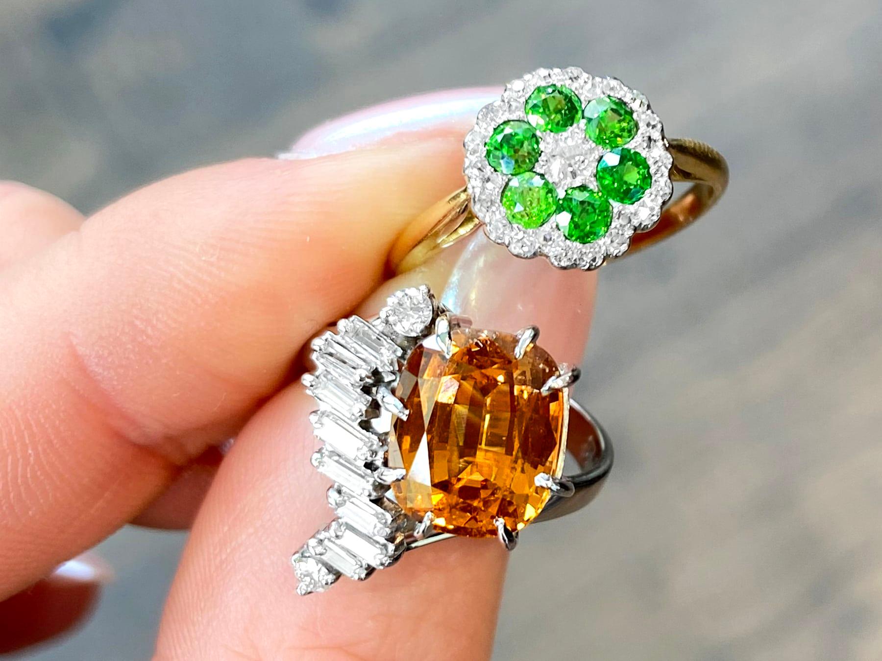 A stunning, fine and impressive antique 0.70 carat demantoid garnet and 0.31 carat diamond, 18 karat yellow gold and platinum set cocktail ring; part of our diverse range of gemstone jewelry.

This stunning, fine and impressive antique gemstone ring