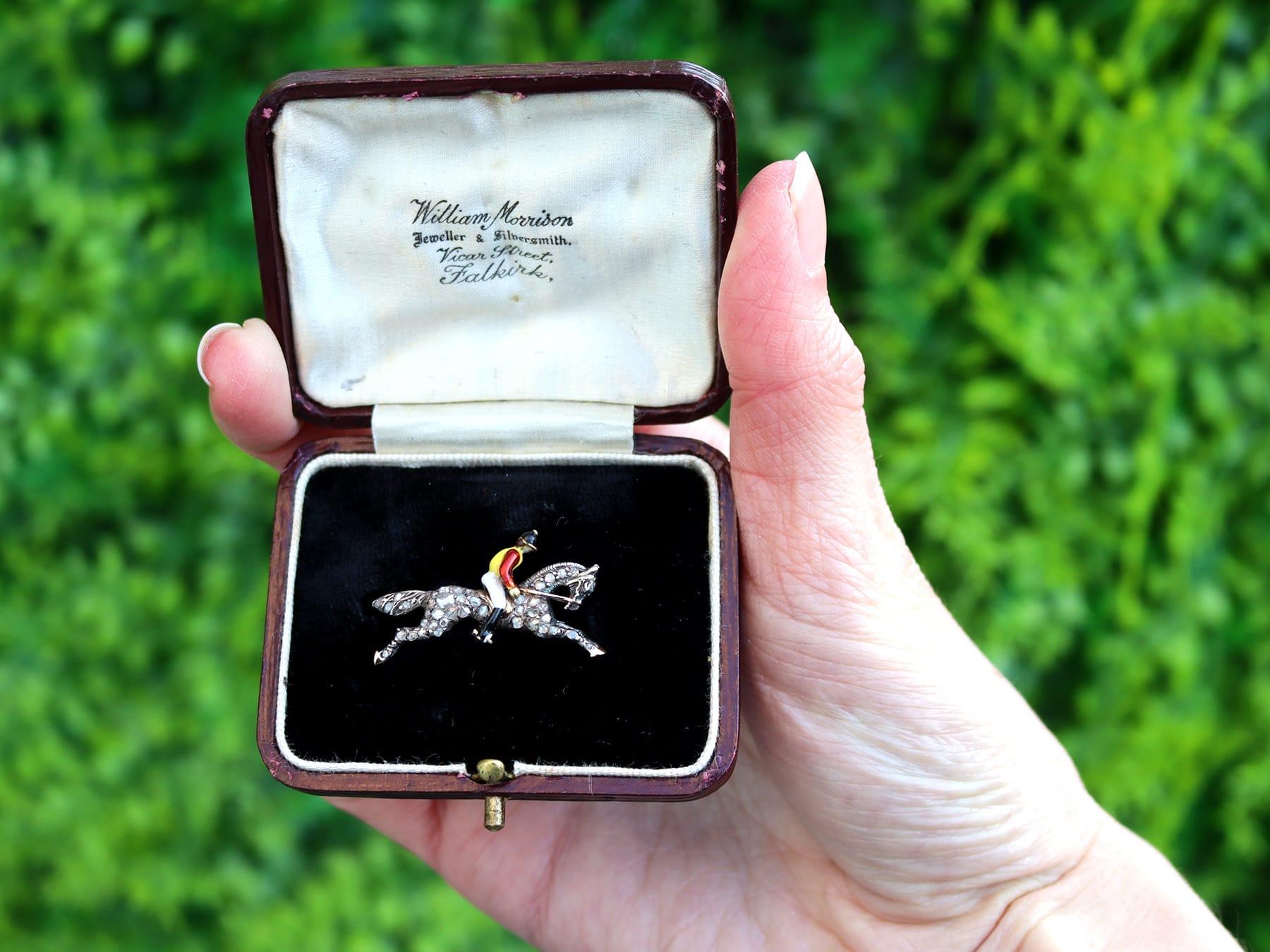 A fine and impressive 0.52 carat diamond and enamel, 12 karat yellow gold and silver set jockey brooch - boxed; part of our diverse antique jewellery collections.

This fine and impressive jockey and horse brooch has been crafted in 12k yellow gold