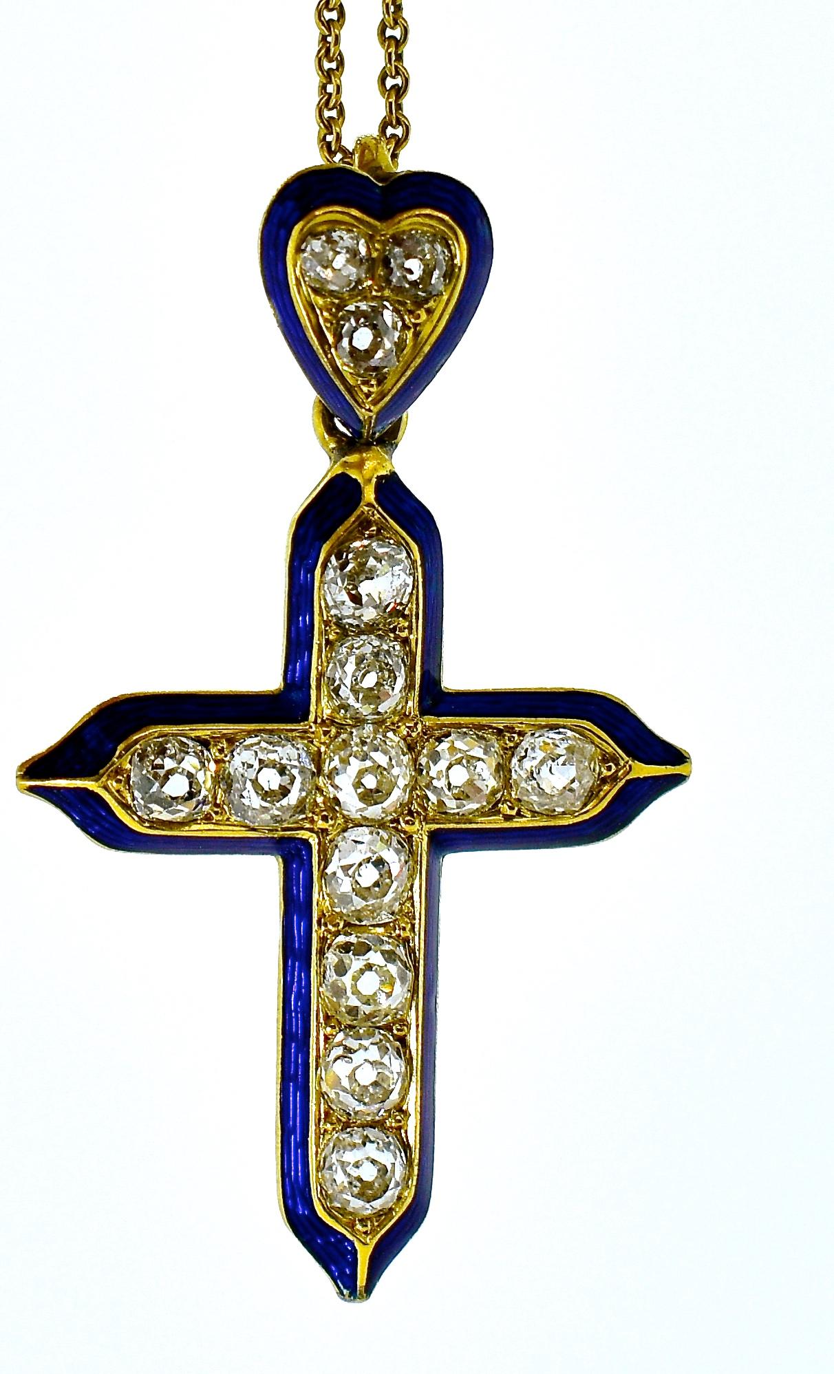 Antique Cross composed of old cut diamonds, 14 in total, all near colorless and slightly included, total estimated weight of these stones is 2.20 cts.  There is cobalt blue enamel outlining the cross which is suspended from a heart shaped bale.  The