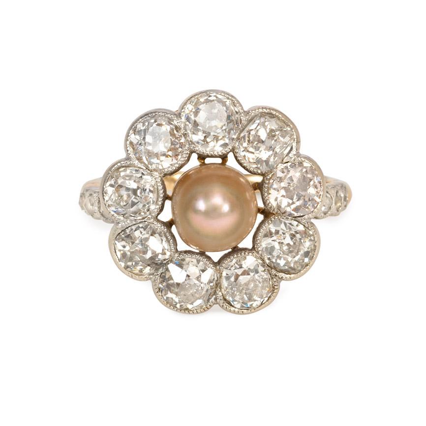 An antique Edwardian period old mine cut diamond and grey pearl floral cluster ring with diamond-accented shoulders, in platinum and 18k gold. French import marks.  Atw 2.50 cts. diamonds.  Pearl approximately 6.2mm

Top measures approximately 16mm