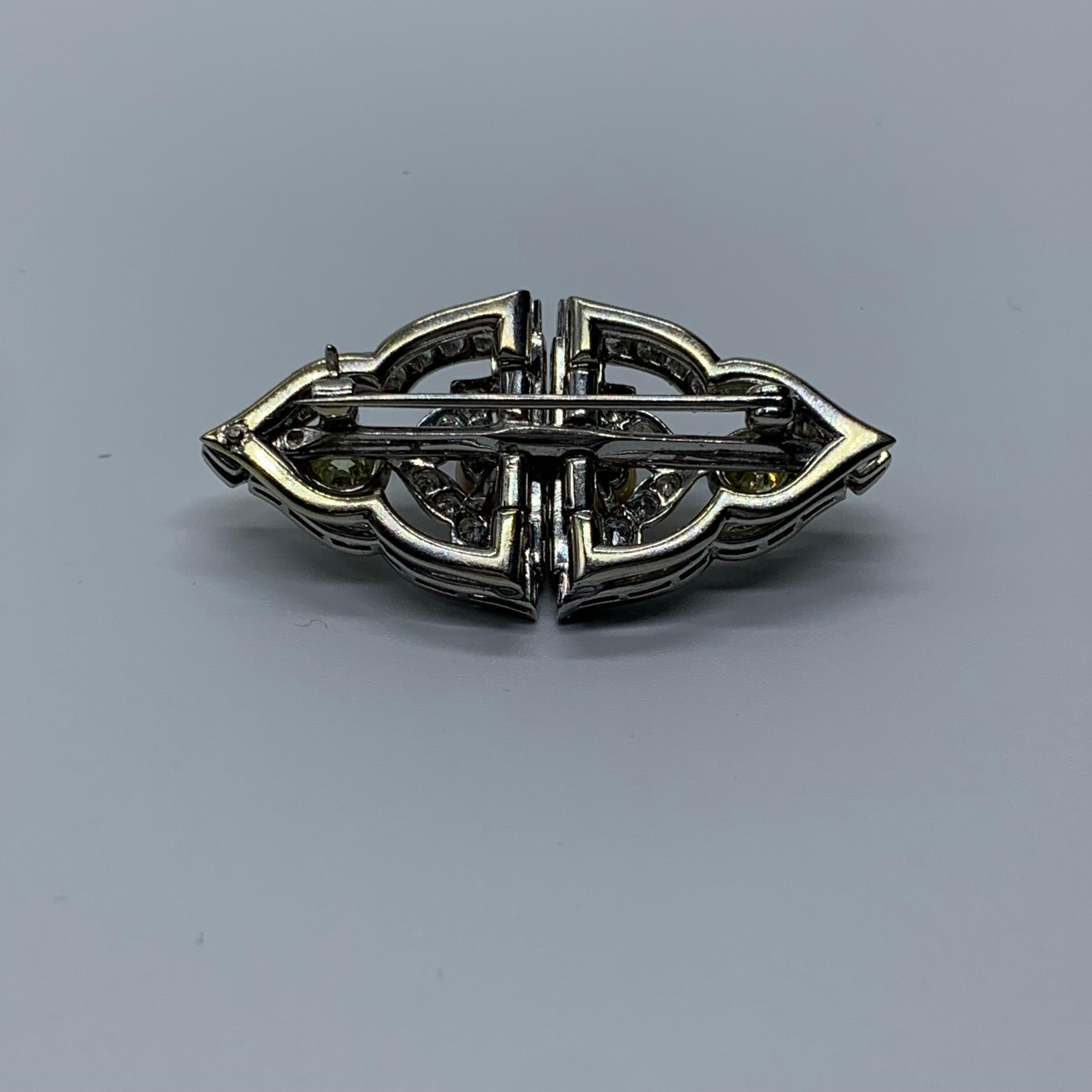 Yellow diamonds and natural pearls dominate each symmetrical side of these lapel pins, surrounded by white old diamonds and set in Art Deco white gold. The genuine article.  Well functioning, gorgeous item.  Could wear as a BROOCH, or have made into