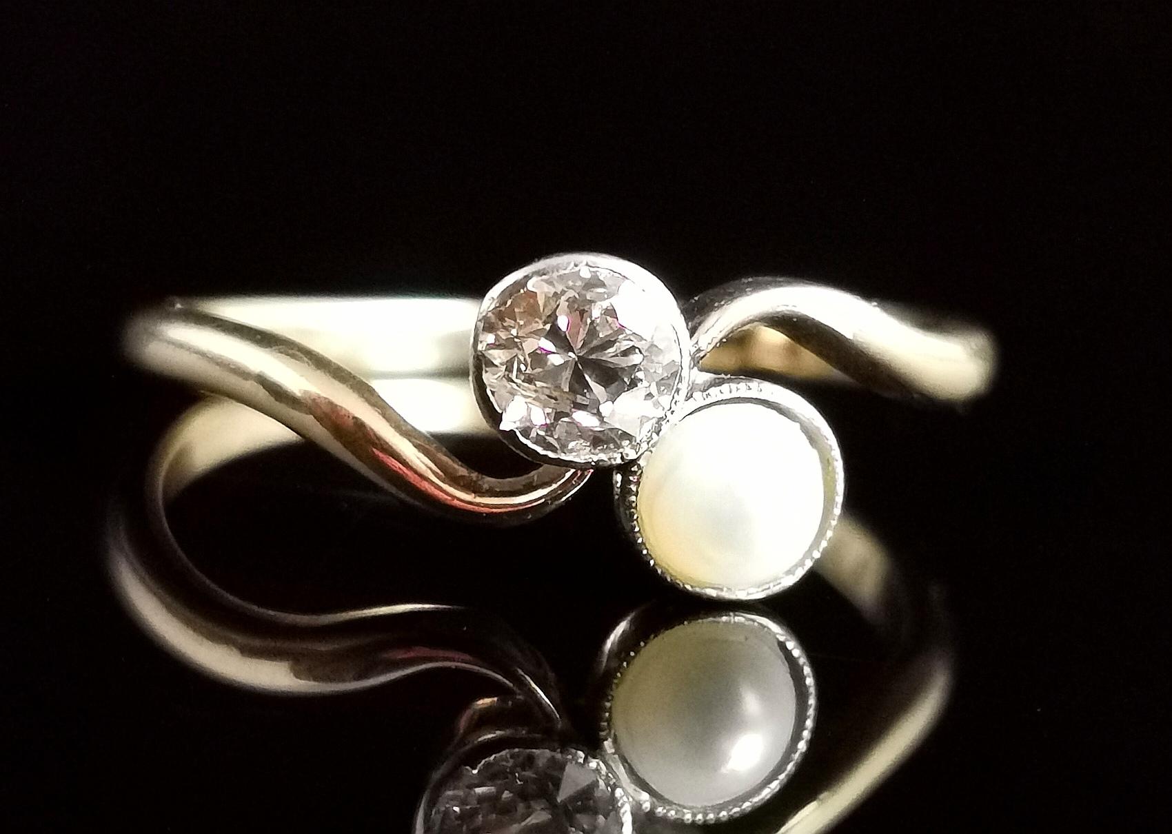 A beautiful antique 18kt gold, Diamond and pearl Crossover ring.

Also affectionately known as the Toi Et Moi which translates to you and me, the joining together of two entities, usually created with two different stones such as this one with its