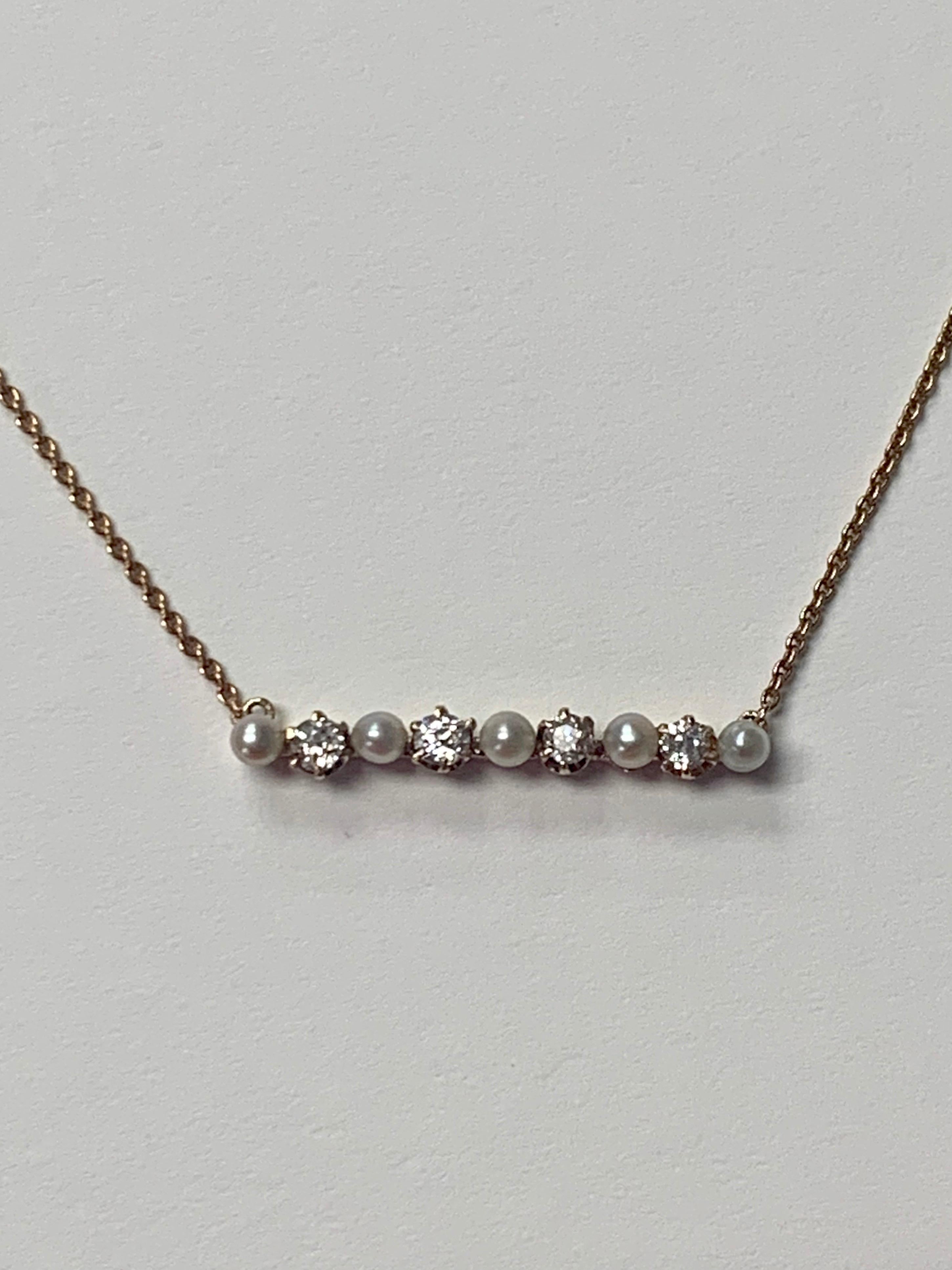 Antique diamond and pearl necklace in 14k gold. 
The details are as follows: 
Diamond weight : 0.40 carat ( SI clarity and H color ) 
Metal : 14K gold 
Pendant measurements : 1 inch wide 

