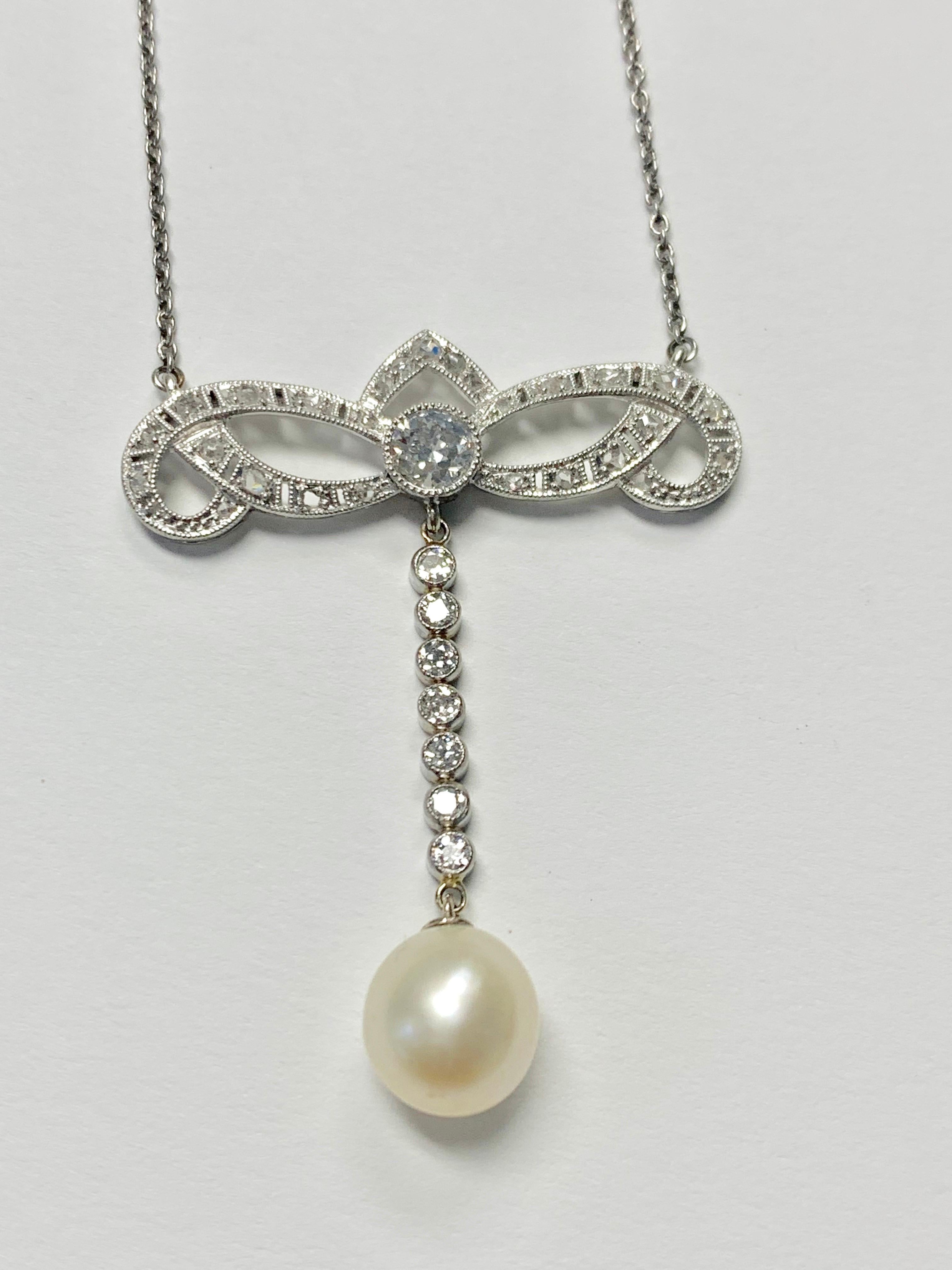 Gorgeous Antique diamond and pearl necklace in platinum and 18k white gold. 
The details are as follows : 
Diamond weight : 1.20 carat
Metal : Platinum and 18k white gold 
Measurements : 1 1/2 inches long 
