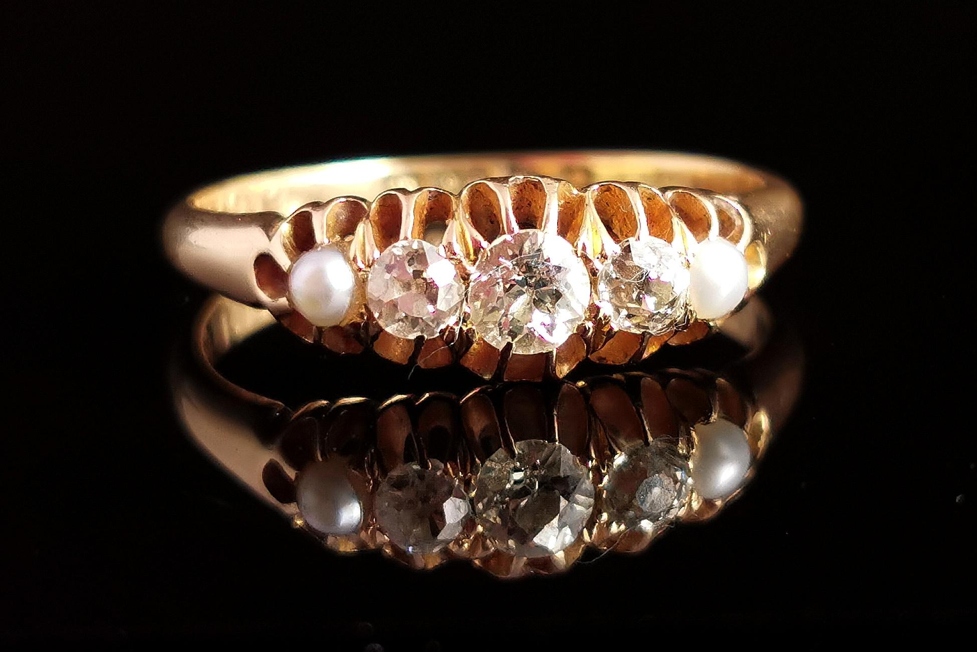 A stunning fine antique, Edwardian old cut diamond and split pearl ring.

This beauty is a boat head style ring in rich buttery 18kt gold, the face is claw set with three sparkling old cut diamonds, the largest to the centre with an estimated 0.25ct