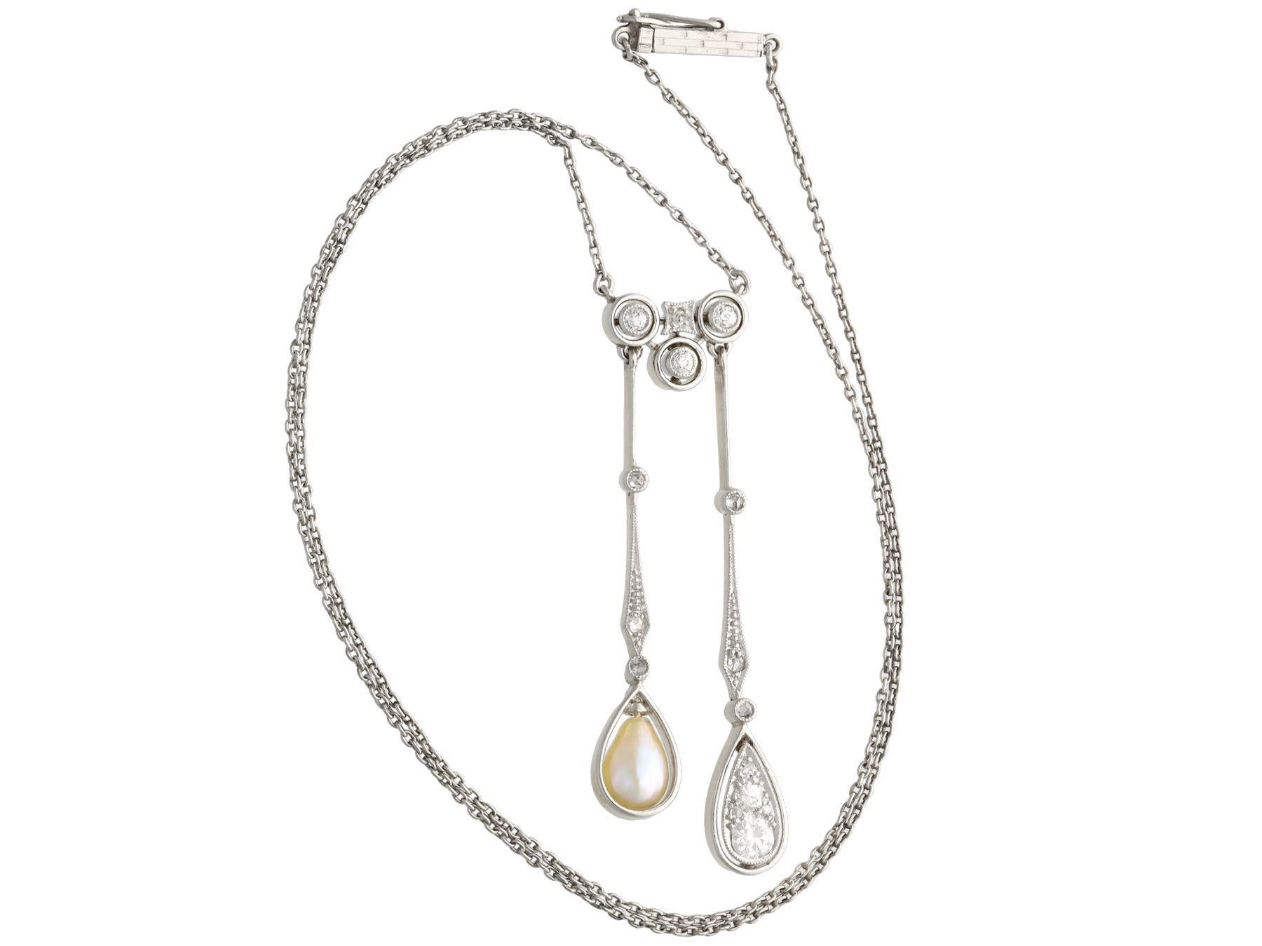 A stunning antique 0.37 carat diamond and pearl, 14 karat yellow gold and platinum gold set pendant; part of our diverse antique jewelry collections.

This stunning, fine and impressive antique diamond and pearl pendant has been crafted in 14k