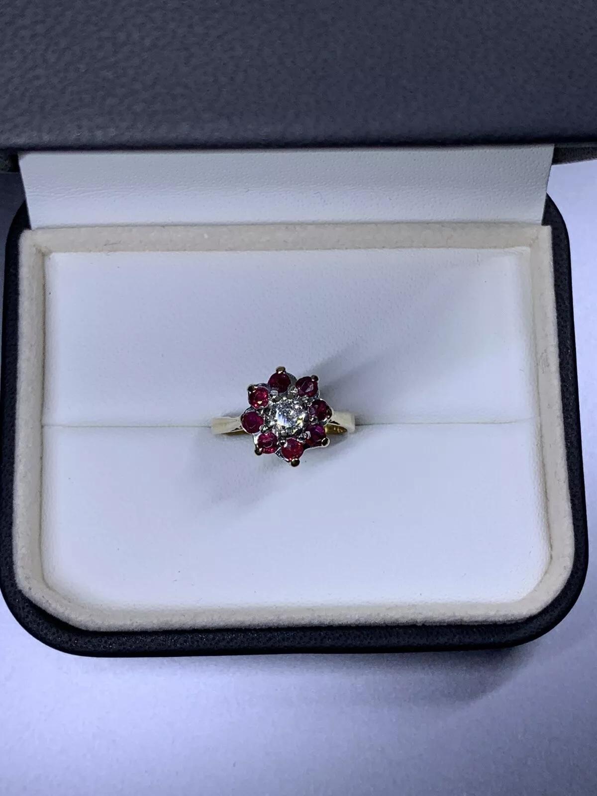 Antique Diamond And Ruby Cluster 18k Yellow Gold Ring.

Beautiful ruby halo.

Natural unheated Ruby total weight 1.00ct

Round brilliant diamond centre stone total weight 0.40ct H colour SI2 clarity

The ring can be resized

Box and valuation