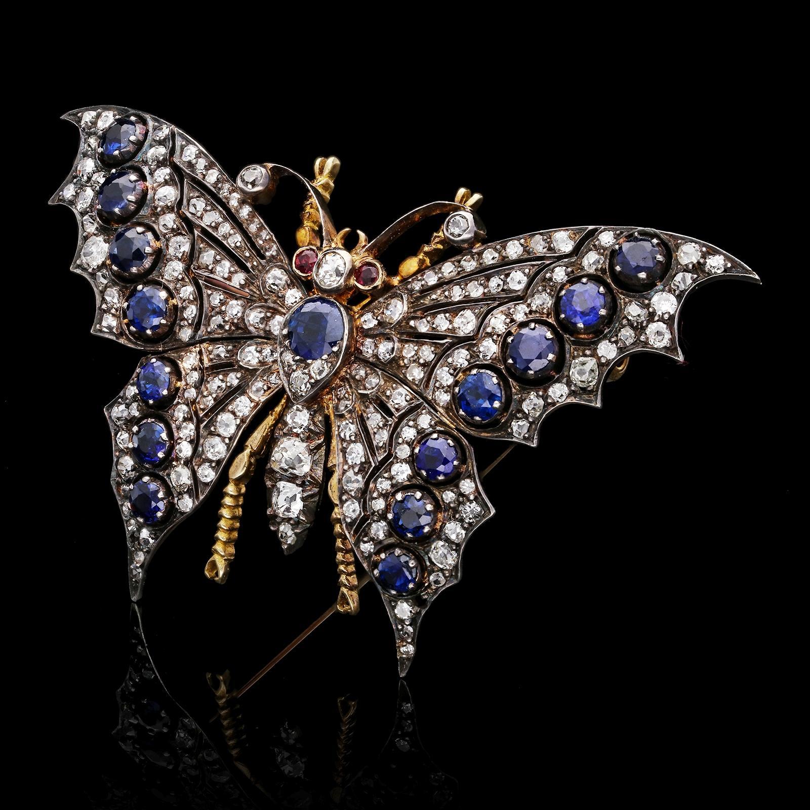 A beautiful Victorian diamond and sapphire butterfly brooch c.1890s, the wings of delicate openwork form set throughout with old cut diamonds, the edges set with a row of blue sapphires, the body set with diamonds and a single sapphire all in silver