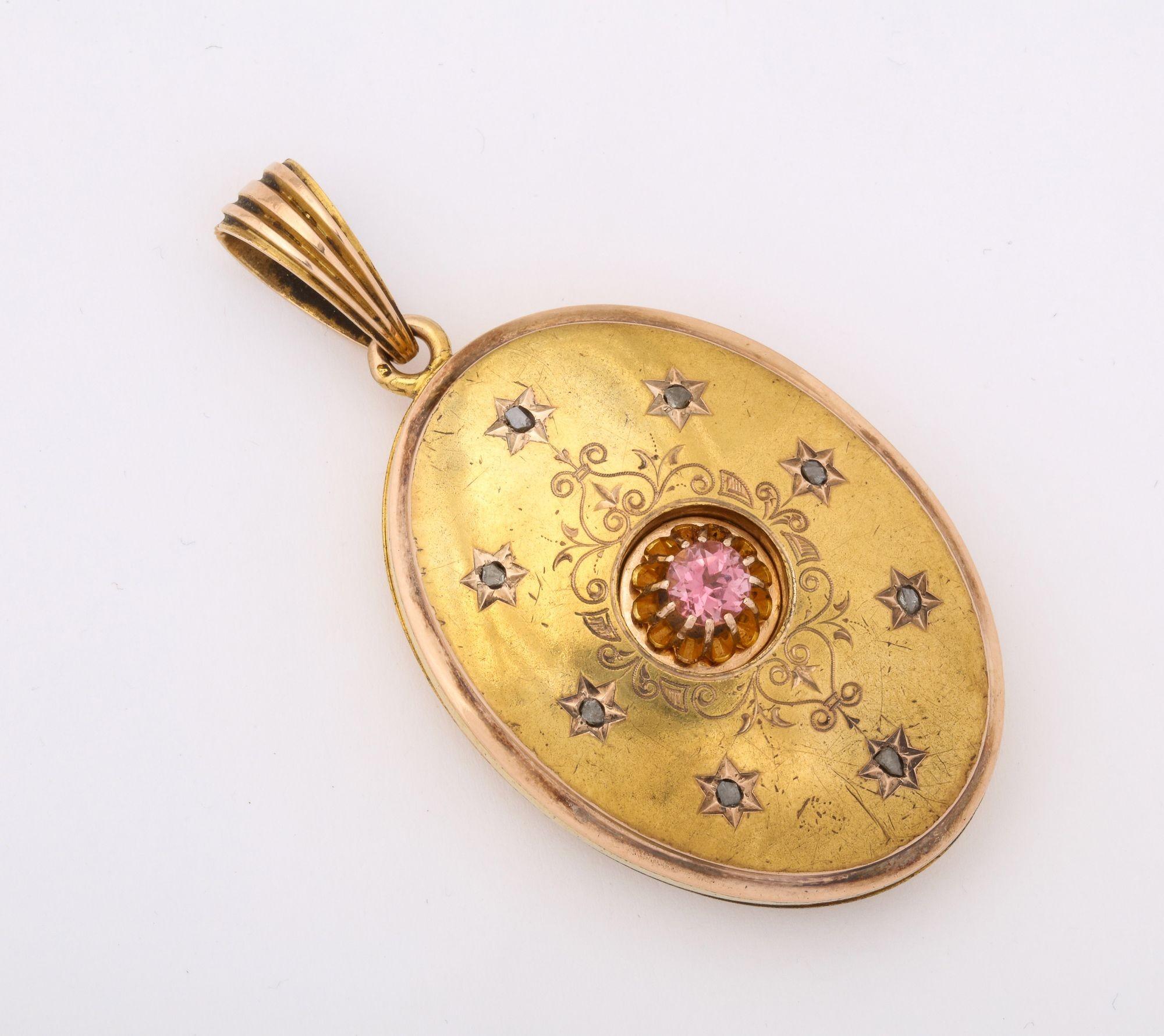 A wonderful Antique Gold Locket with inset rose diamonds,pink  tourmaline and chased decoration. Vienna gold touch marks..
