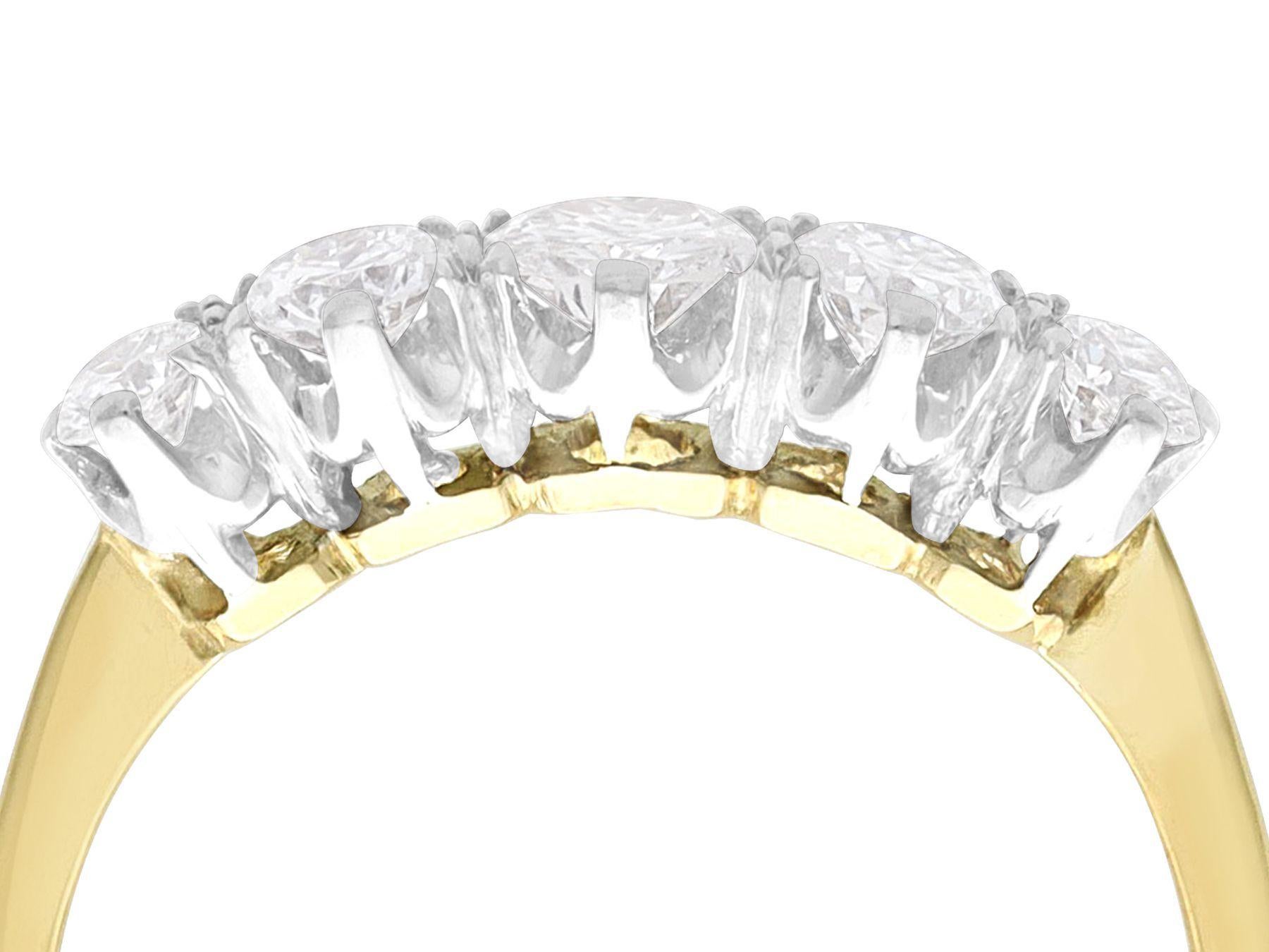 A fine and impressive antique 0.73 carat diamond, 18 karat yellow gold and platinum set five stone ring; part of our antique jewelry and estate jewelry collections.

This fine and impressive antique five stone ring has been crafted in 18k yellow