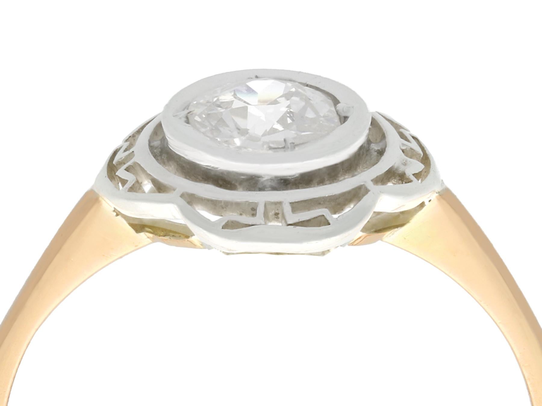 A fine and impressive 0.51 carat diamond, 14 karat yellow gold and silver set solitaire ring; part of our collection of antique diamond rings.

This fine and impressive bezel set diamond ring has been crafted in 14k yellow gold with a silver