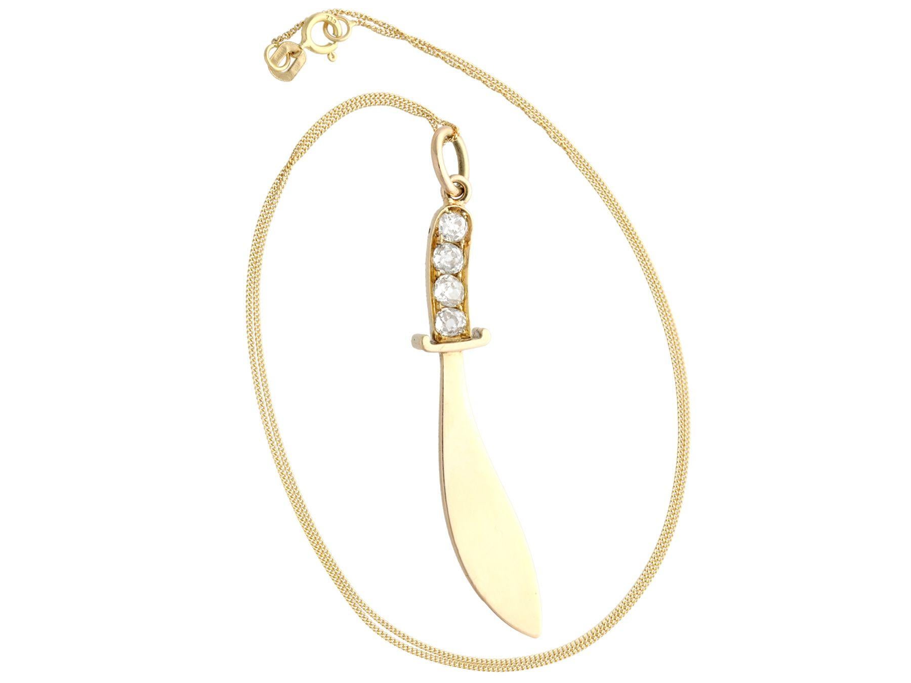 A fine and impressive 0.88 carat diamond and 14k yellow gold pendant in the form of a sword; part of our diverse antique jewelry and estate jewelry collections.

This fine and impressive gold pendant has been crafted in 14k yellow gold.

The pendant