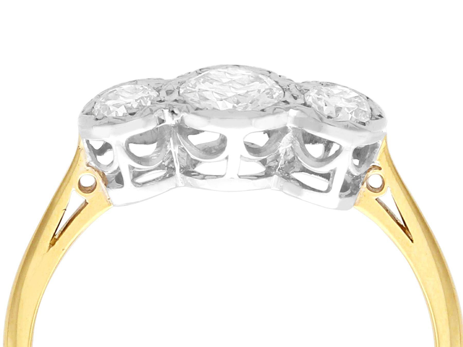 A fine and impressive antique 0.70 carat diamond and 18 karat yellow gold, platinum set trilogy ring; part of our diverse antique jewelry collections

This fine and impressive antique three stone ring has been crafted in 18k yellow gold with a