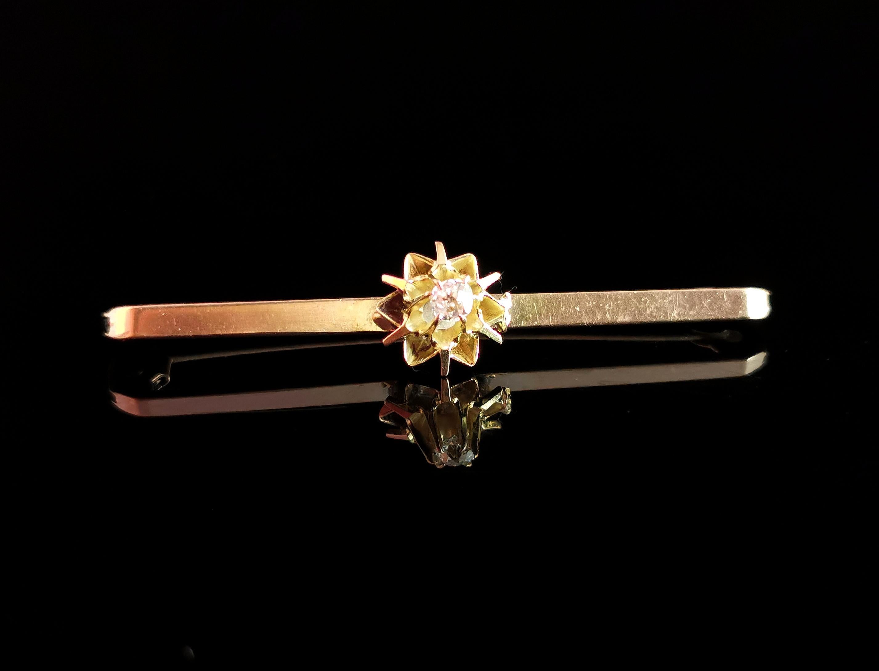 A stylish antique diamond bar brooch.

A slim and rich 9kt yellow gold bar set to the centre with a raised old cut diamond in a claw setting.

The Diamond is nice and bright, approx 0.10ct.

It is stamped on the underside 9ct, English make,