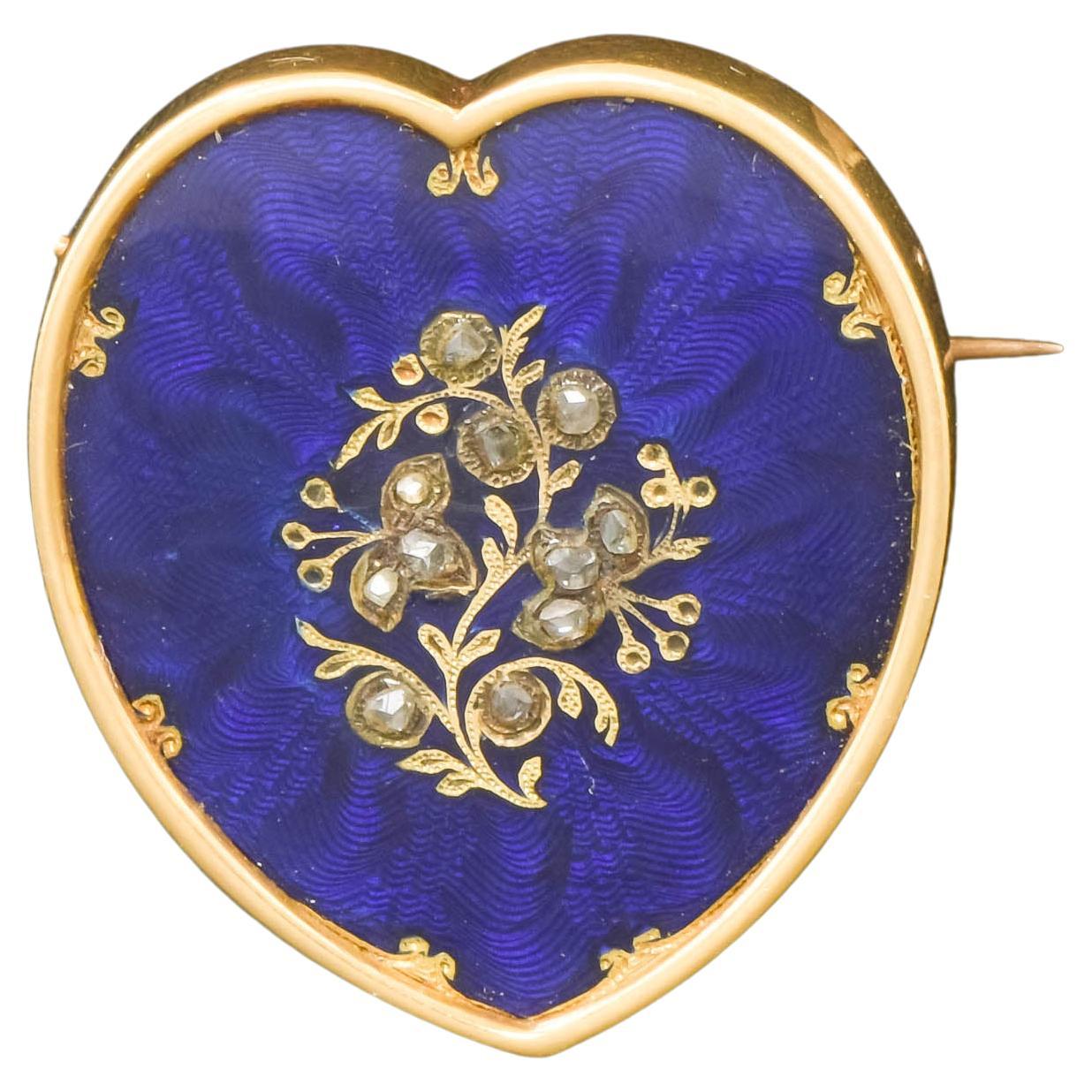 Broche cœur ancienne en or émaillé guilloché et diamants bleus