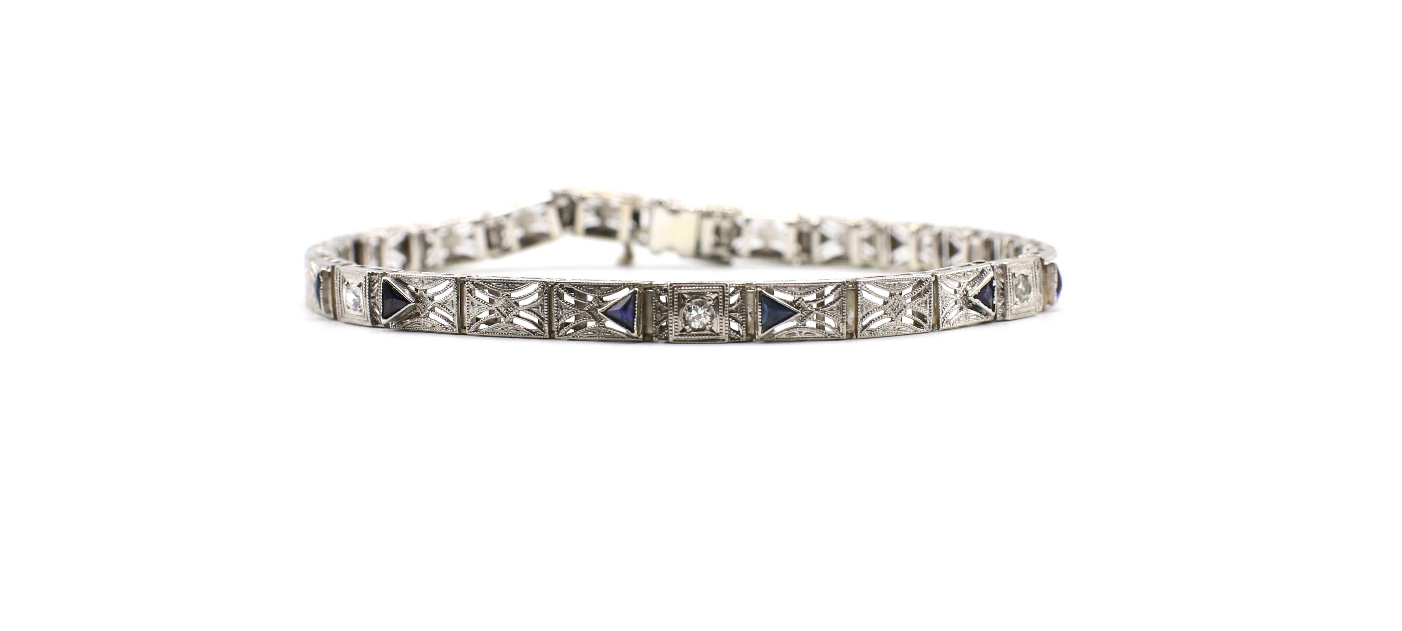 Antique Diamond & Period Manufactured Sapphire Filigree 14k White Gold Bracelet 

Metal: 14k White Gold
Weight: 8.5 grams
Diamonds: 3 Old European Cut diamonds, approx 0.12ctw G-H SI
Sapphires: 6 trillion cut sapphires (period manufactured) each