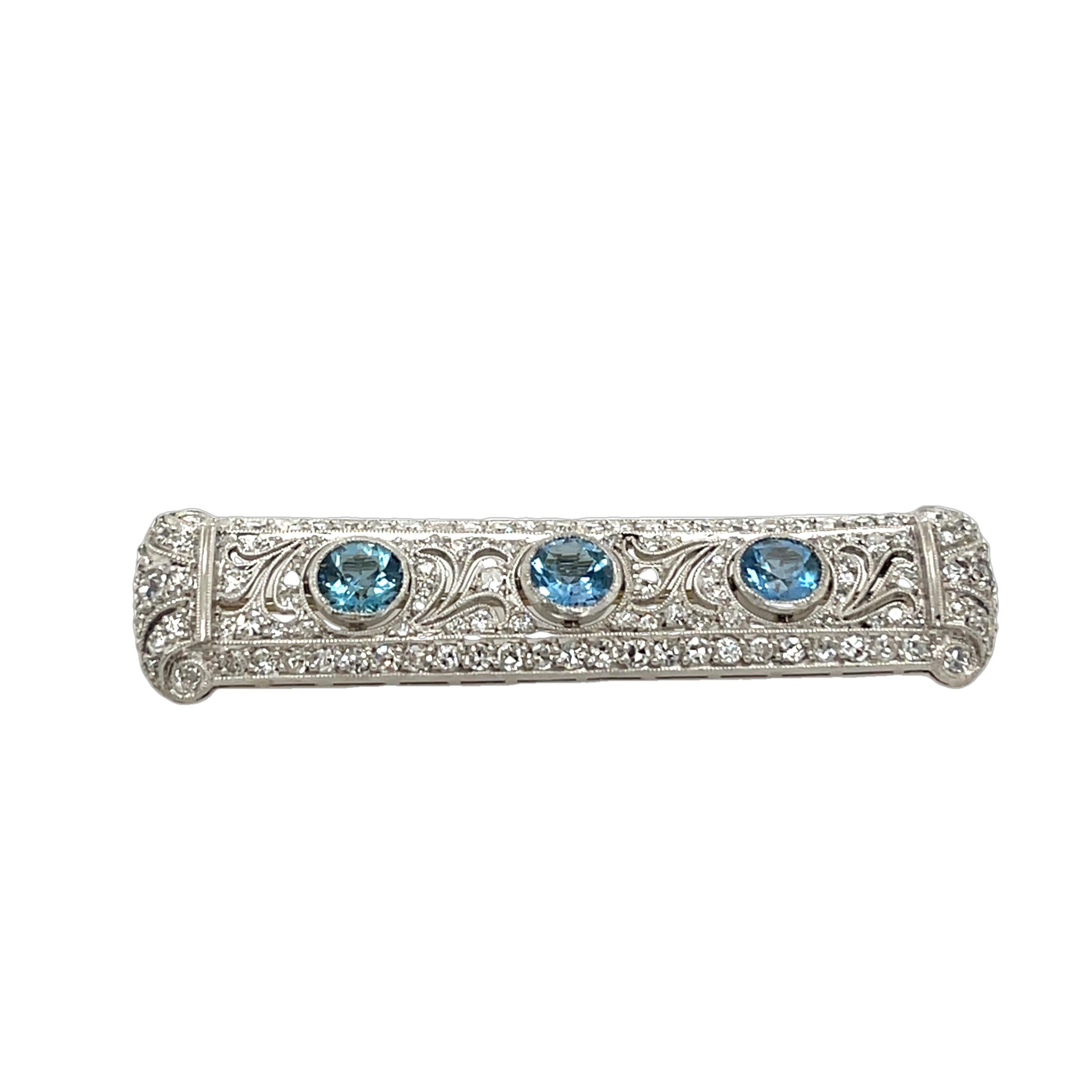 Antique diamond & aquamarine brooch, 
showcasing 2.0ct of round old cut diamonds 
and 3 round aquamarines. 
Expertly crafted in a vintage setting, 
this exquisite piece embodies elegance and timeless charm.

Total Gold Weight: 12g
Total Diamond