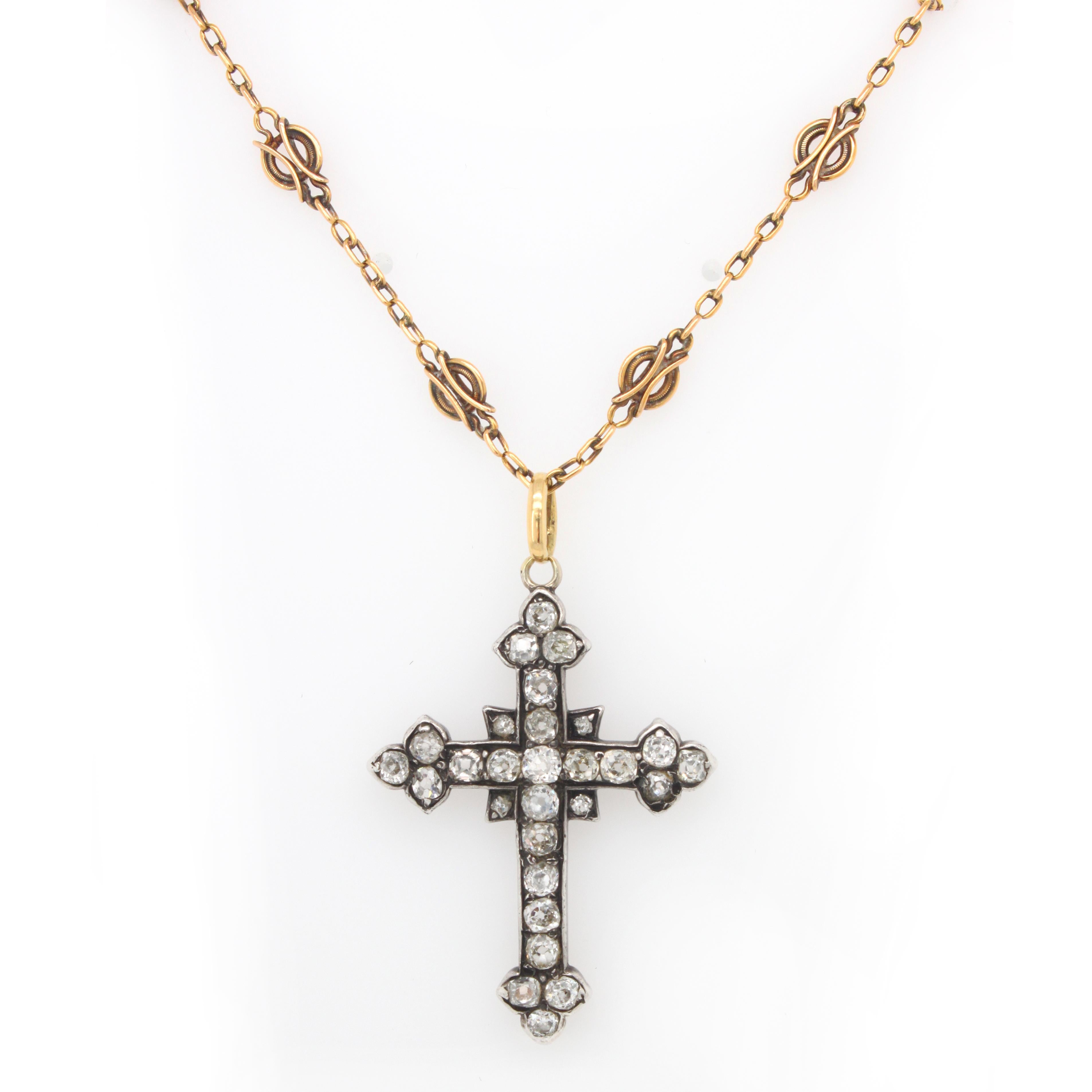 An antique diamond cross with with a king’s chain, 19th Century. The cross is set with 28 old European cut diamonds, weighing approximately 2.5 carats. The length of the chain is approximately 52 centimetres.