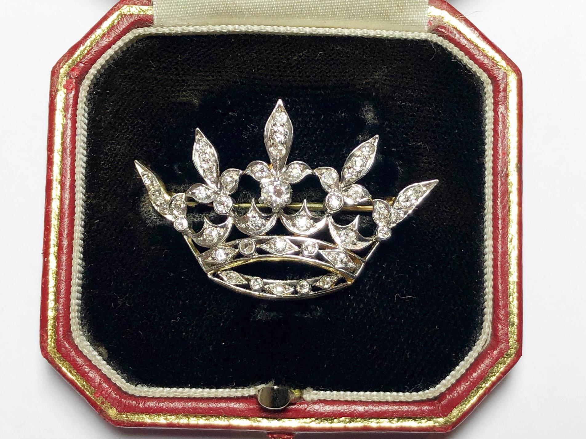 An antique diamond crown brooch, set with Edwardian and old-cut diamonds, mounted in yellow gold with platinum settings, circa 1915.
