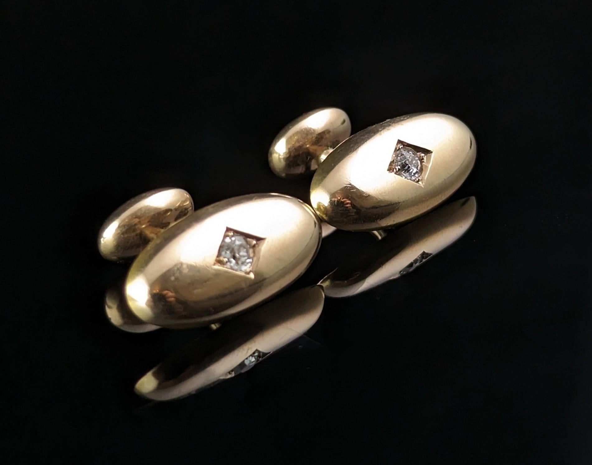 A gorgeous pair of Victorian diamond cufflinks.

These are such a beautifully crafted pair on rich 18ct gold with the warm and deep bloom only found on antique gold pieces.

Each cufflink is set with a single old cut diamond, approx 0.39ct Total,