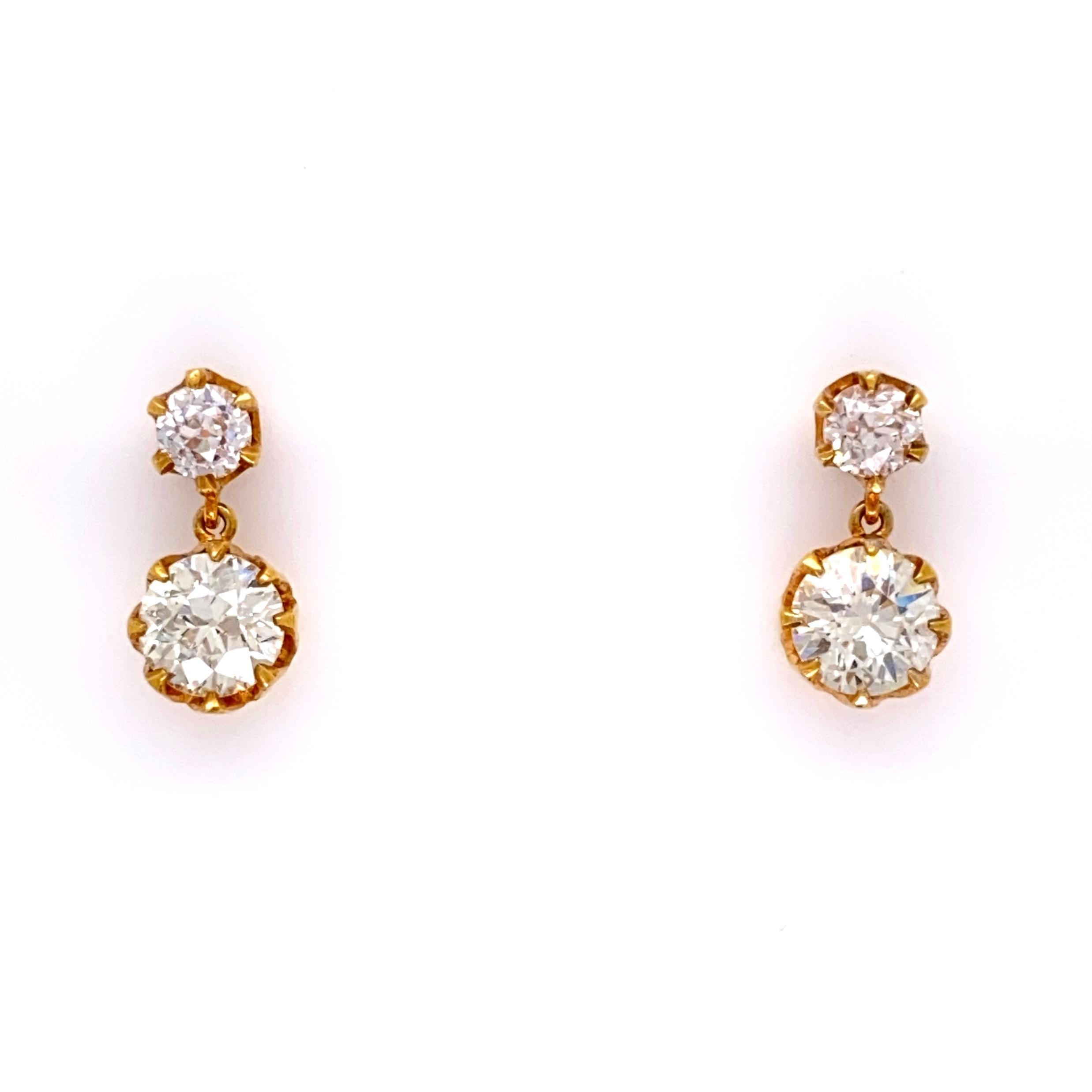 Simply Beautiful! Finely detailed Double Drop Gold Earrings. Hand set with 2 Old European Diamonds weighing approx. 1.60tcw and 2 Diamonds, approx. 0.36tcw. Measuring approx. 0.50