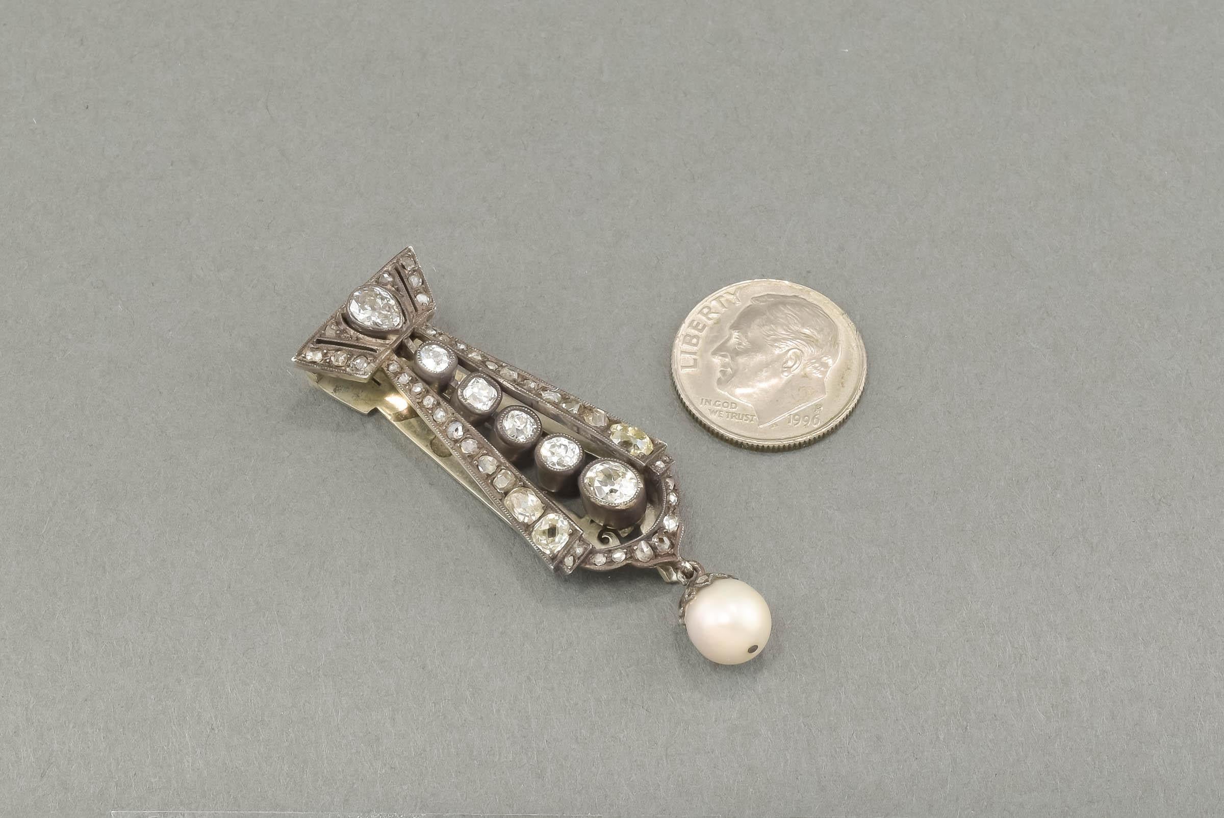 An absolutely stunning Victorian period Diamond & Pearl Pendant - Dress Clip with super fiery old mine cut & rose cut diamonds along with a sizable lustrous pearl drop.  Just gorgeous & so much more wonderful in person. 

Crafted of silver and gold