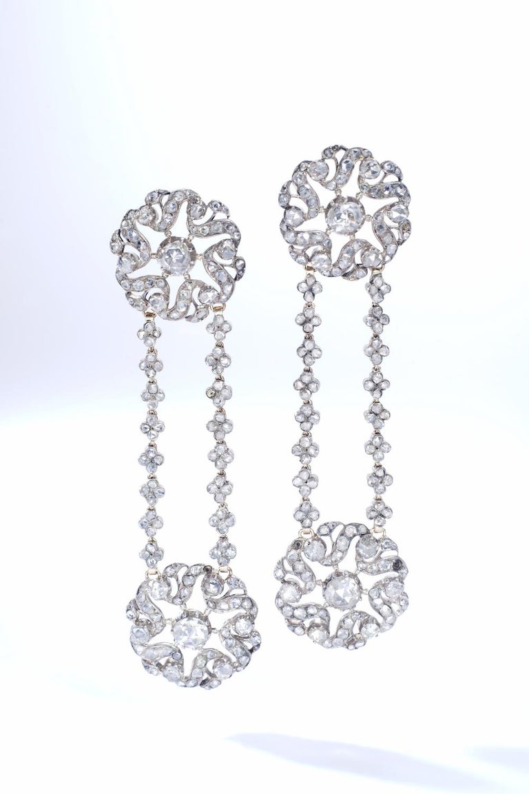 Antique Rose cut Diamond Ear Pendants on silver and gold. Austrian work. Late 19th Century.

Total height: 3.15 inches ( 8.00 centimeters).