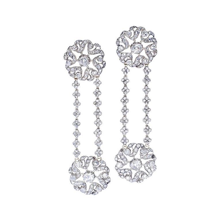 A pair of captivating antique Rose cut Diamond Ear Pendants, crafted on silver and gold with Austrian workmanship, dating back to the late 19th century. These earrings are a true testament to the elegance and beauty of a bygone era.

These exquisite