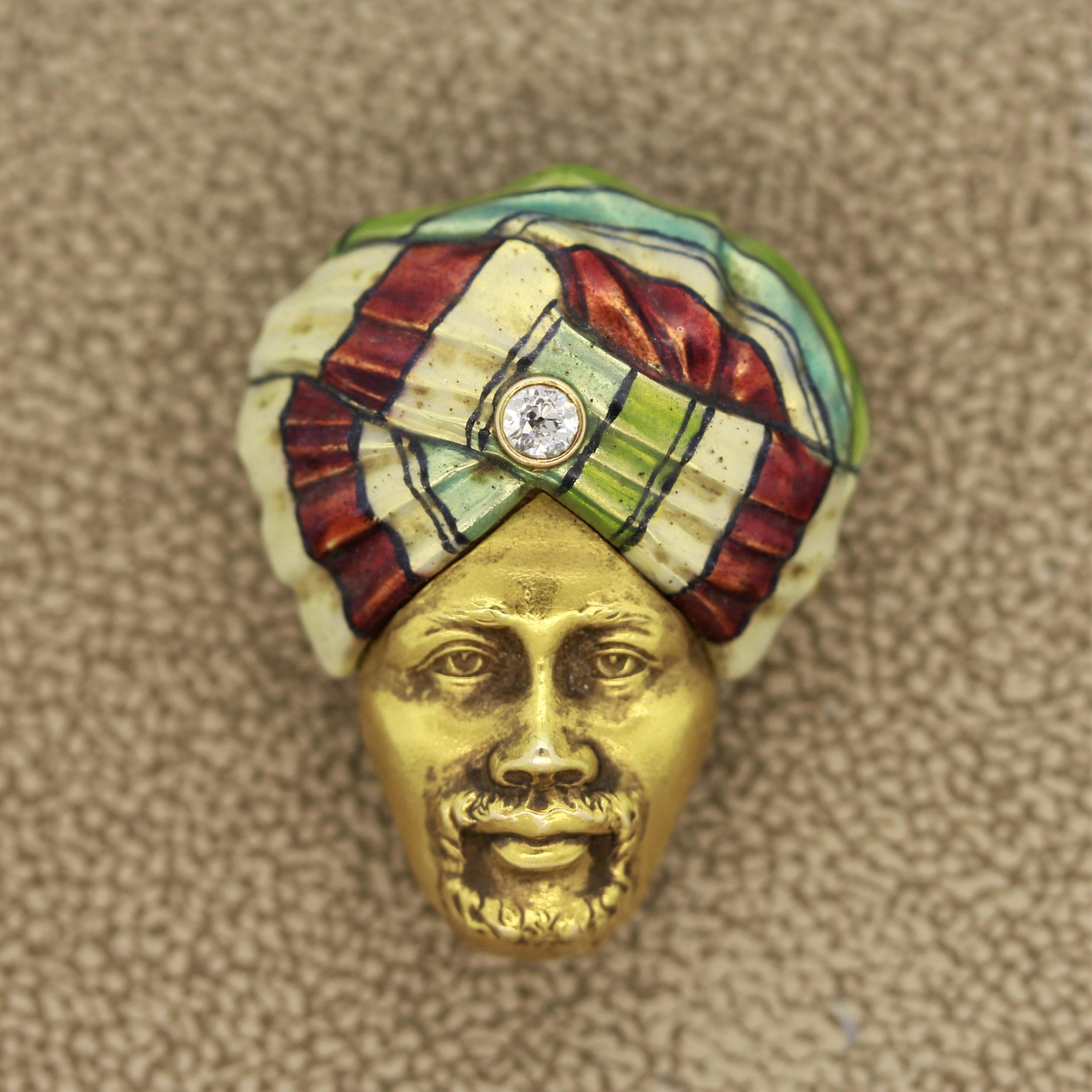 A fantastically designed piece from the turn of the 20th century. It features a dignified man with a bright enamel turban with a round European cut diamond set in it. Hand made in 14k yellow gold, this treasure will make a great addition or any
