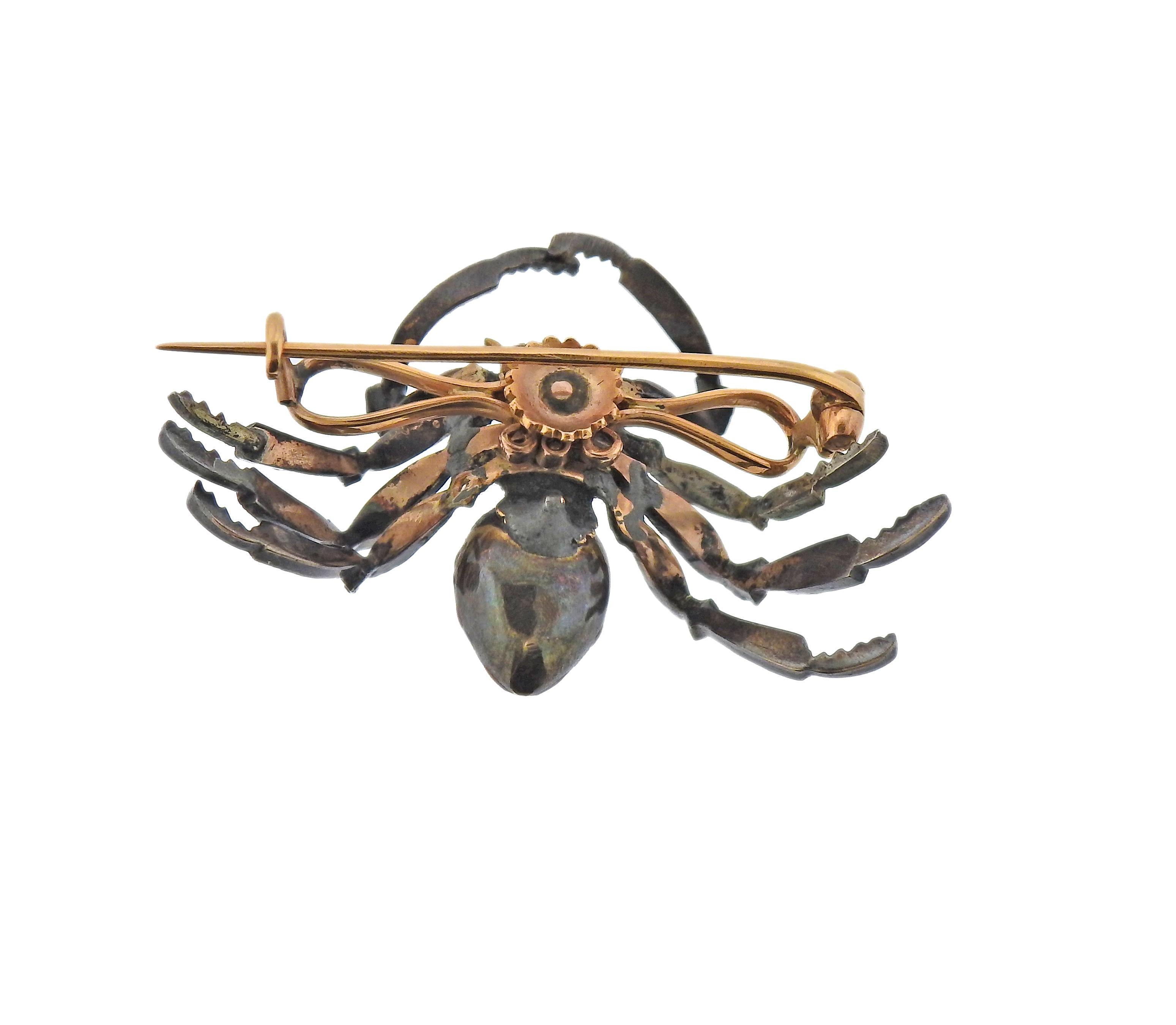 Antique silver and 14k gold spider brooch, set with rose cut diamonds and enamel. Brooch measures 45mm x 29mm. Weight - 10.3 grams. 