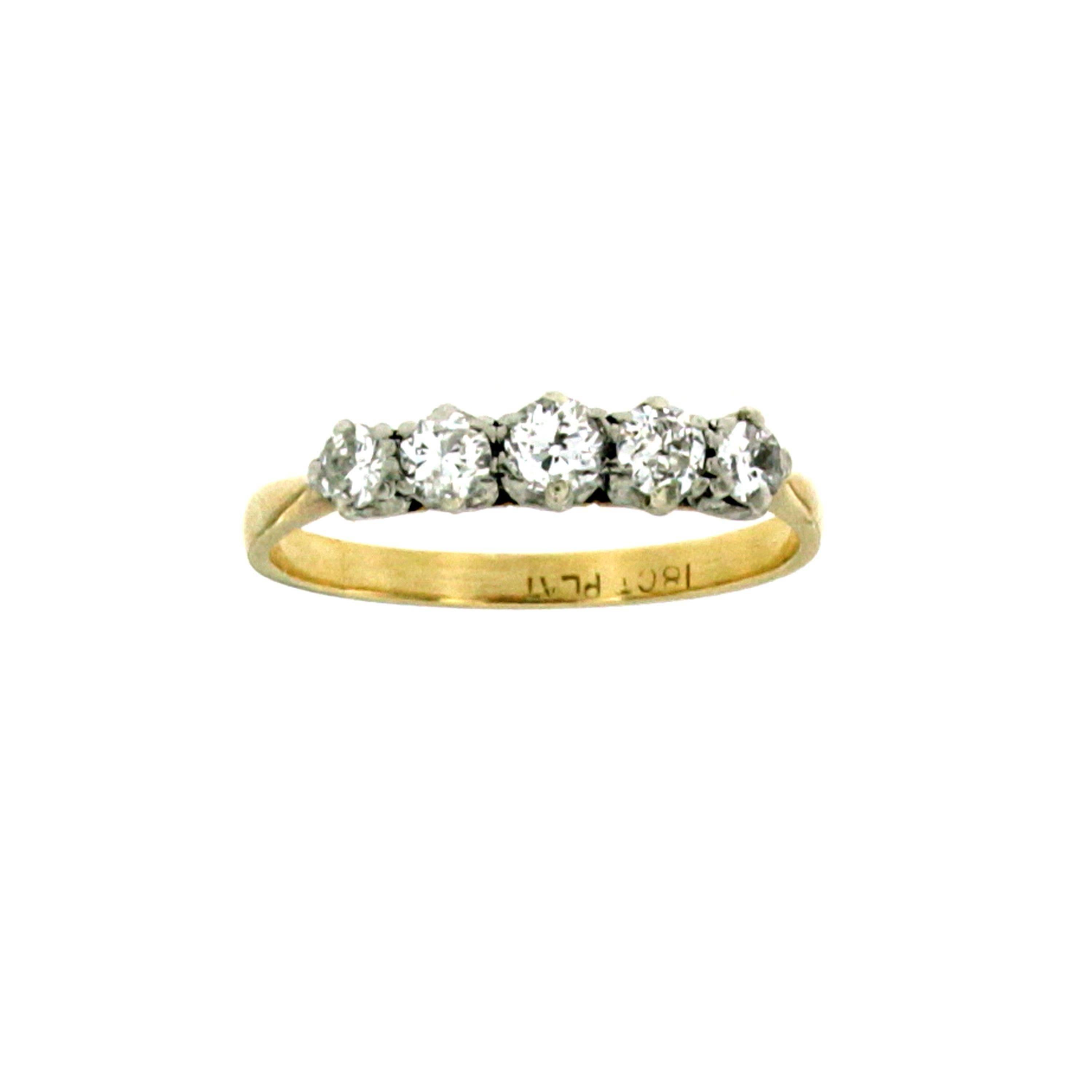 This elegant band ring dated 1940s, is hand-crafted in solid 18k white gold and Platinum, it is set with five sparkling Old mine cut Diamond, weighing all together 0,50 carats and graded H color Vs clarity.
Stamped 18ct and PL 


CONDITION: