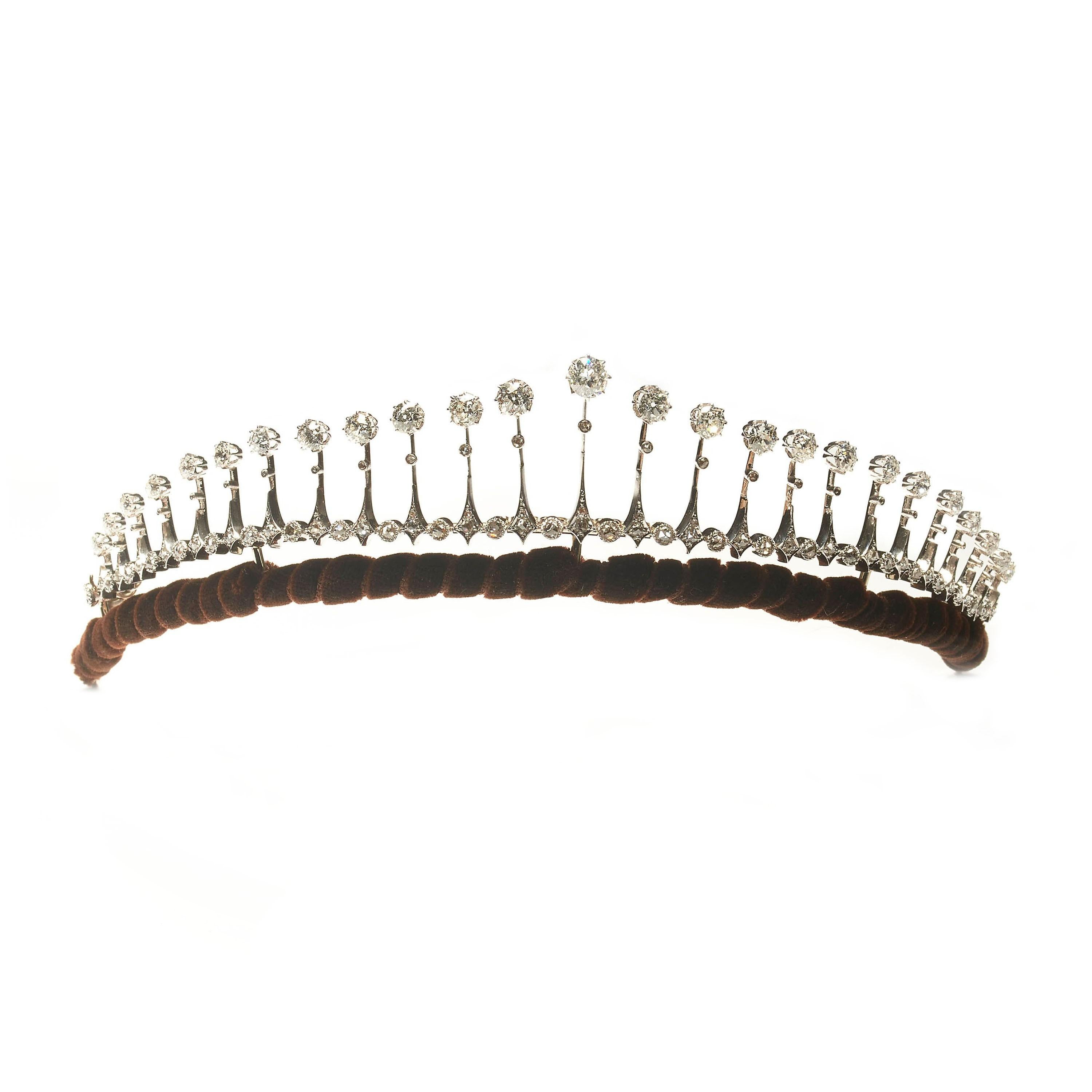 An antique, French, diamond fringe tiara necklace, with rose-cut diamonds in rub over settings, alternating with graduating old-cut diamond drops, with an estimated total diamond weight of 12.00ct, the back piece detaches to wear as a separate