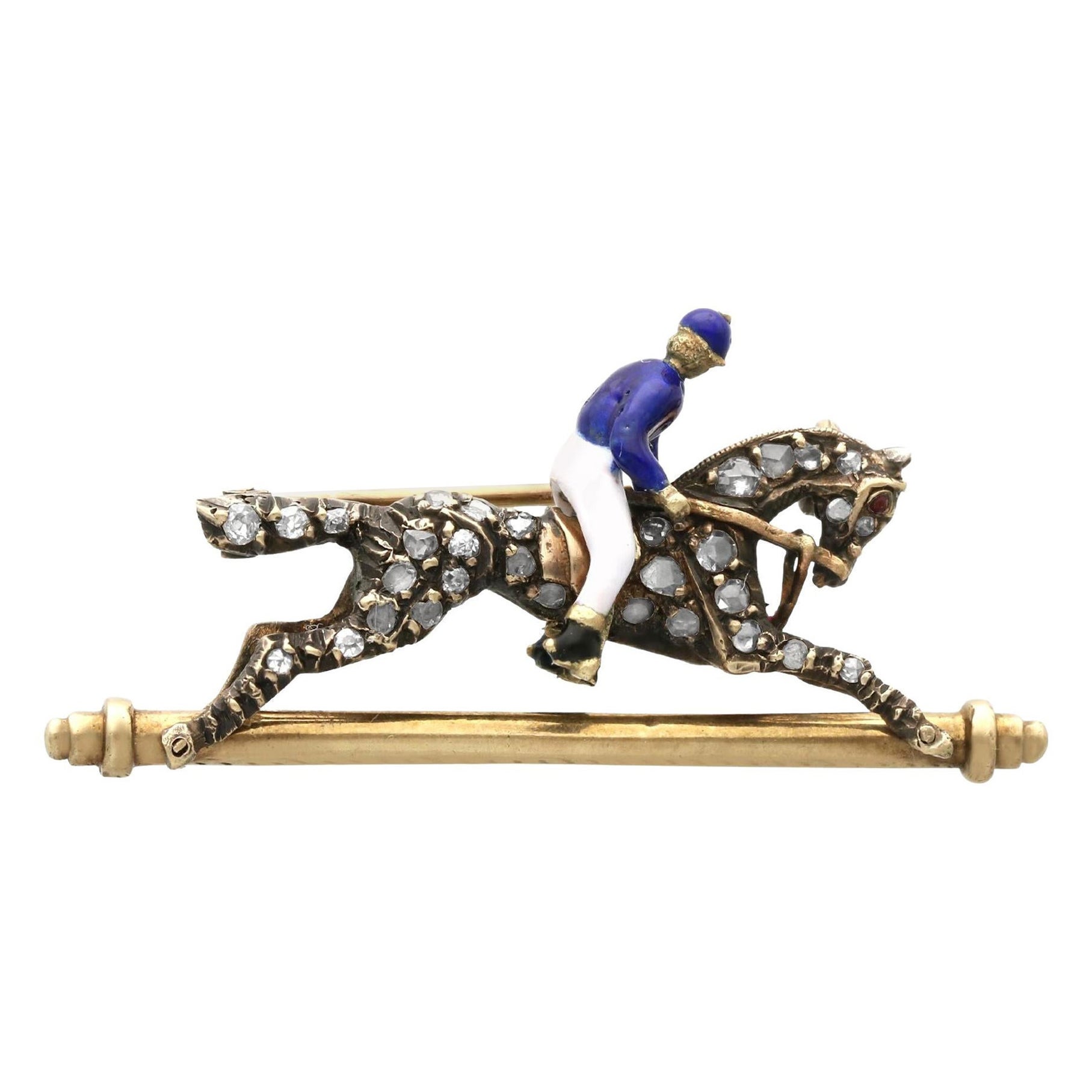 Broche ancienne cheval et jockey en or jaune, grenat, émail et diamants