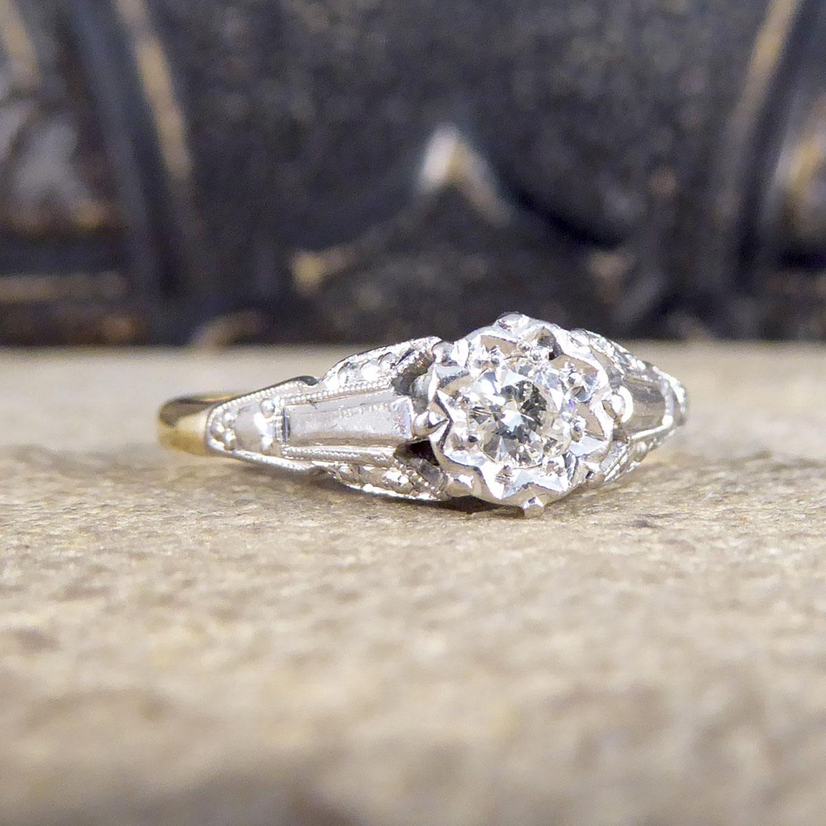 A pretty 18ct Yellow Gold and Platinum ring that was made in the 1920's. This ring features an Old European Cut Diamond in the centre weighing approximately 0.15ct Diamond in the centre that is clear and bright in an illusion setting creating the