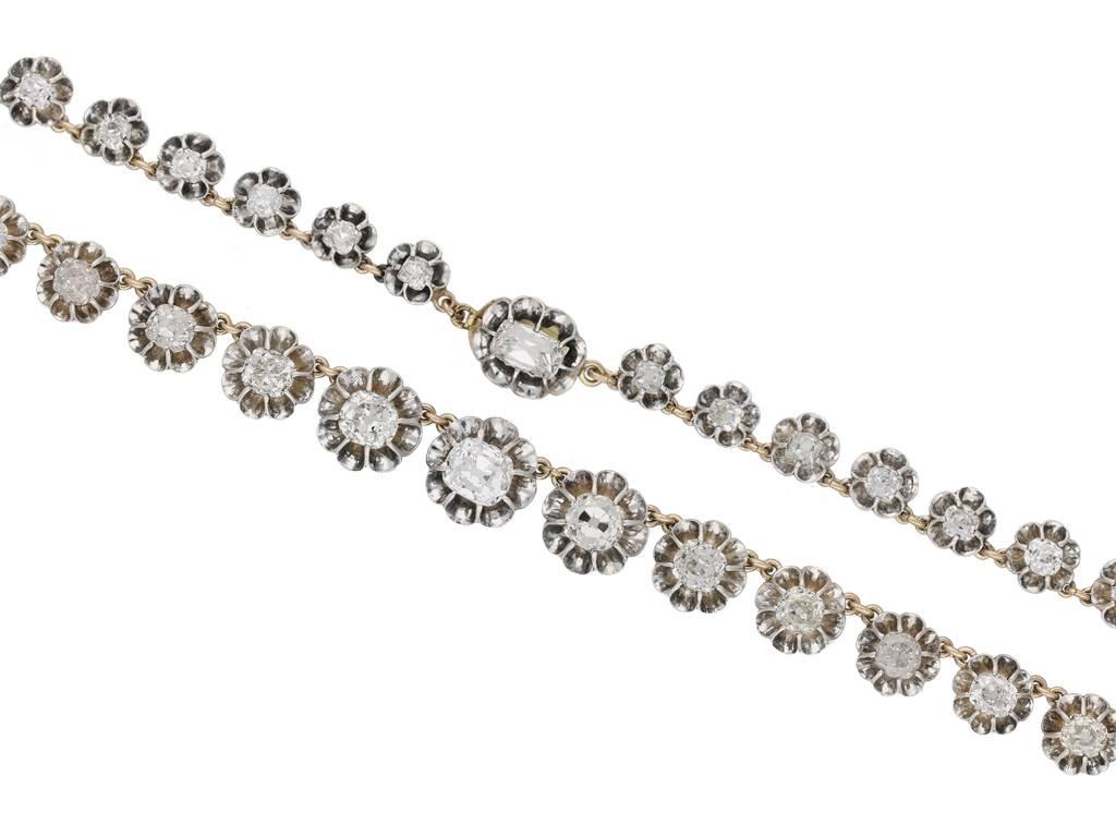 Antique diamond necklace. Set with one cushion shape old mine diamond in an open back raised claw setting with a weight of 1.32 carats, further set with thirty nine cushion shape old mine diamonds in similar settings with a combined weight of 14.00