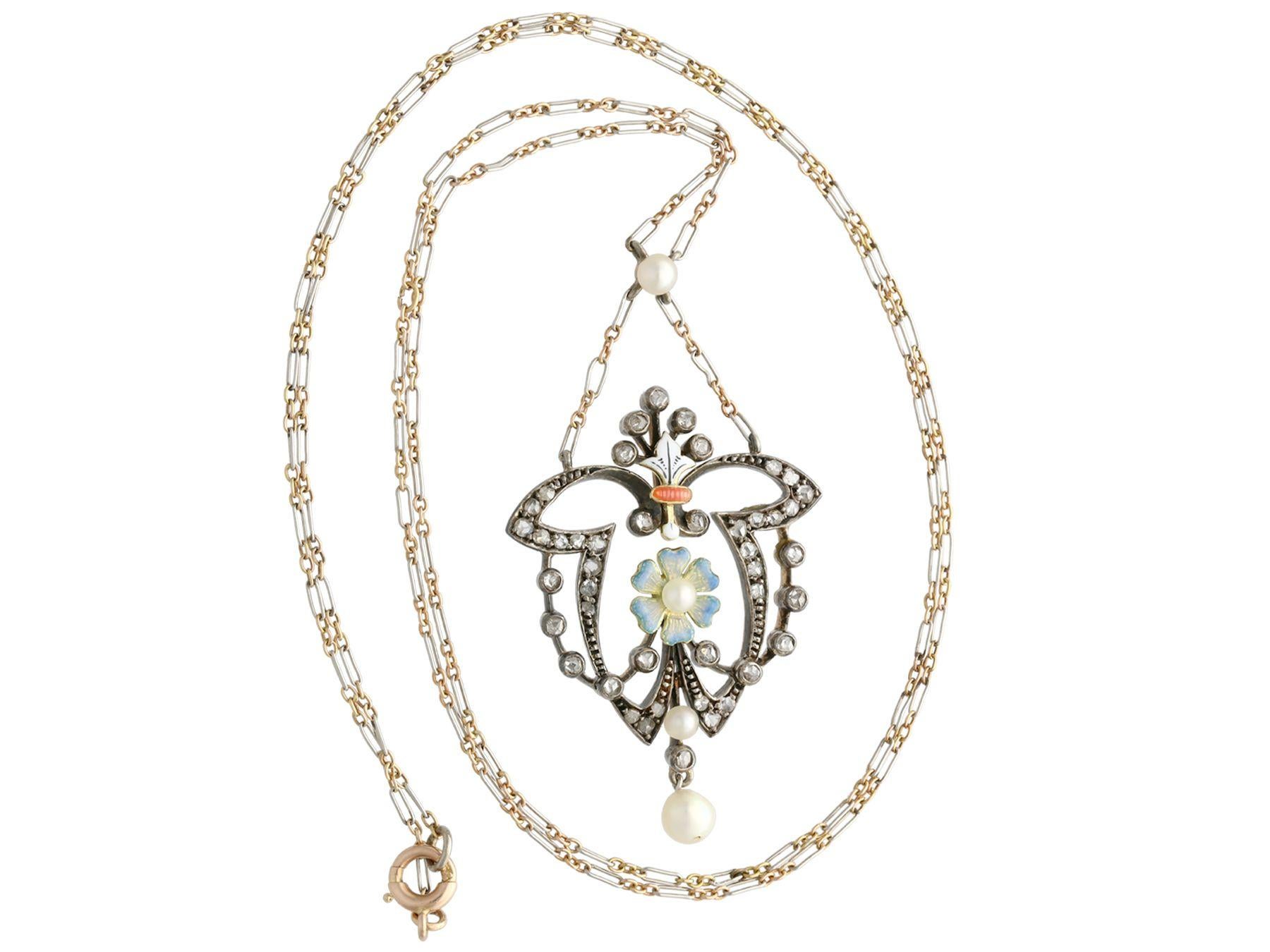 A stunning antique Victorian 0.55 carat diamond, pearl and enamel, 12 karat yellow gold and silver set necklace; part of our diverse antique jewelry and estate jewelry collections.

This stunning, fine and impressive antique antique pendant has been