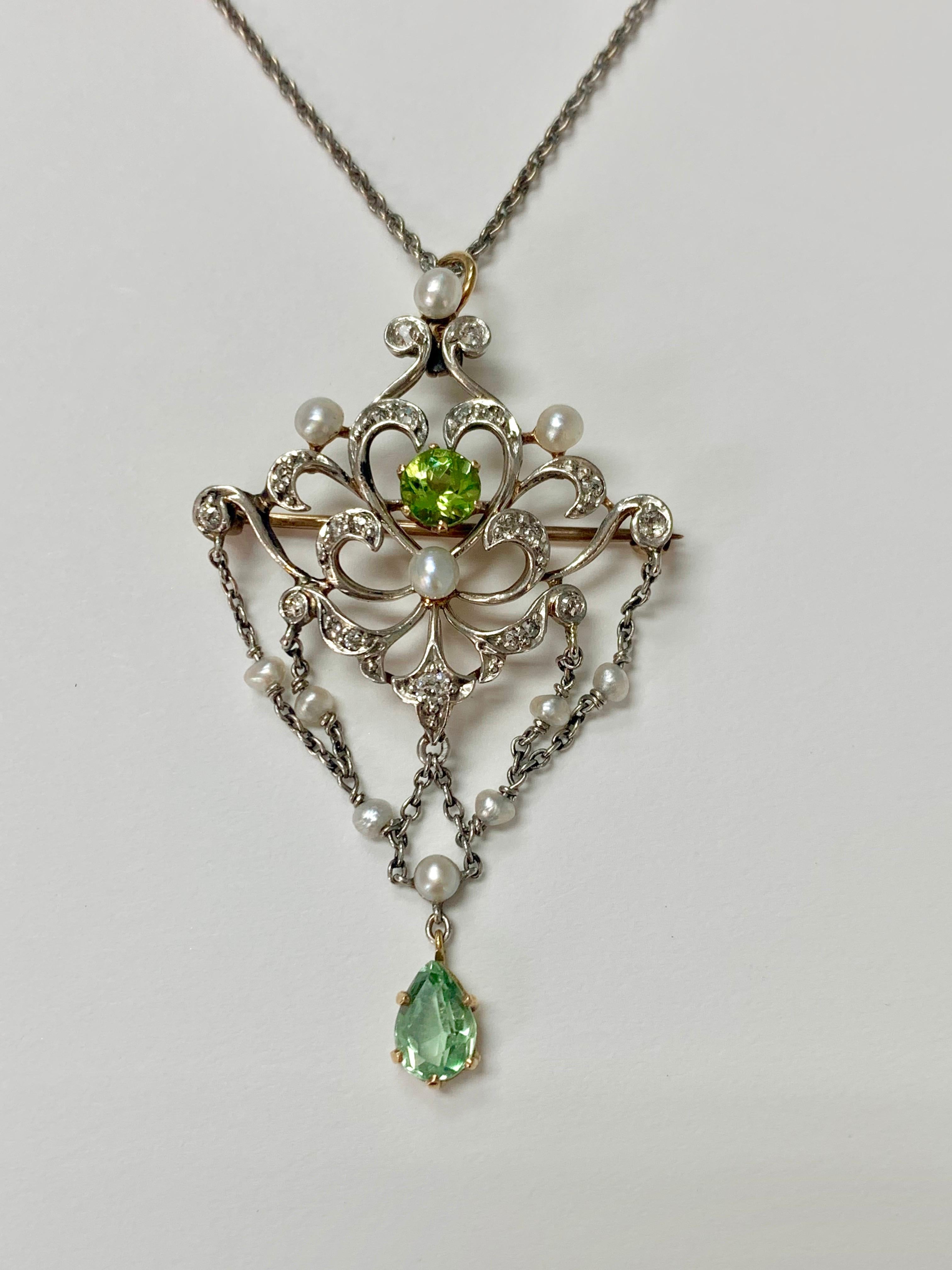 Antique diamond pearl and peridot necklace handcrafted in 14k white gold. 
The details are as follows : 
Diamond weight : 0.50 carat ( GH color SI clarity ) 
Metal : 14K white gold 
