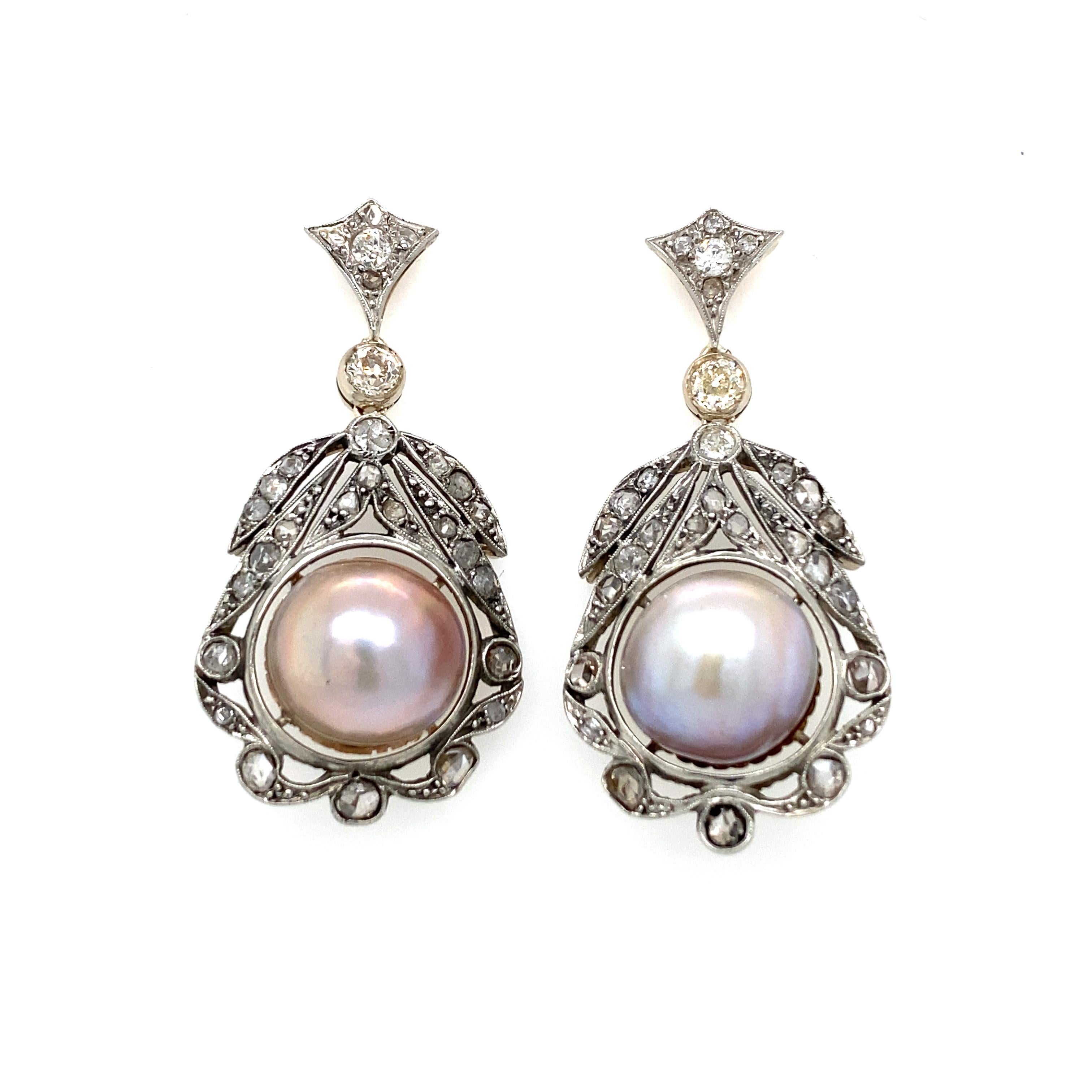 This important pair of diamond 18k gold earrings feature sparkling Old mine cut and Rose cut Diamonds weighing a total of approximately 1.70 carat, graded from H/K color with Vs clarity, and two cultured mabè pearls 12 mm. 
Circa 1800'

CONDITION: