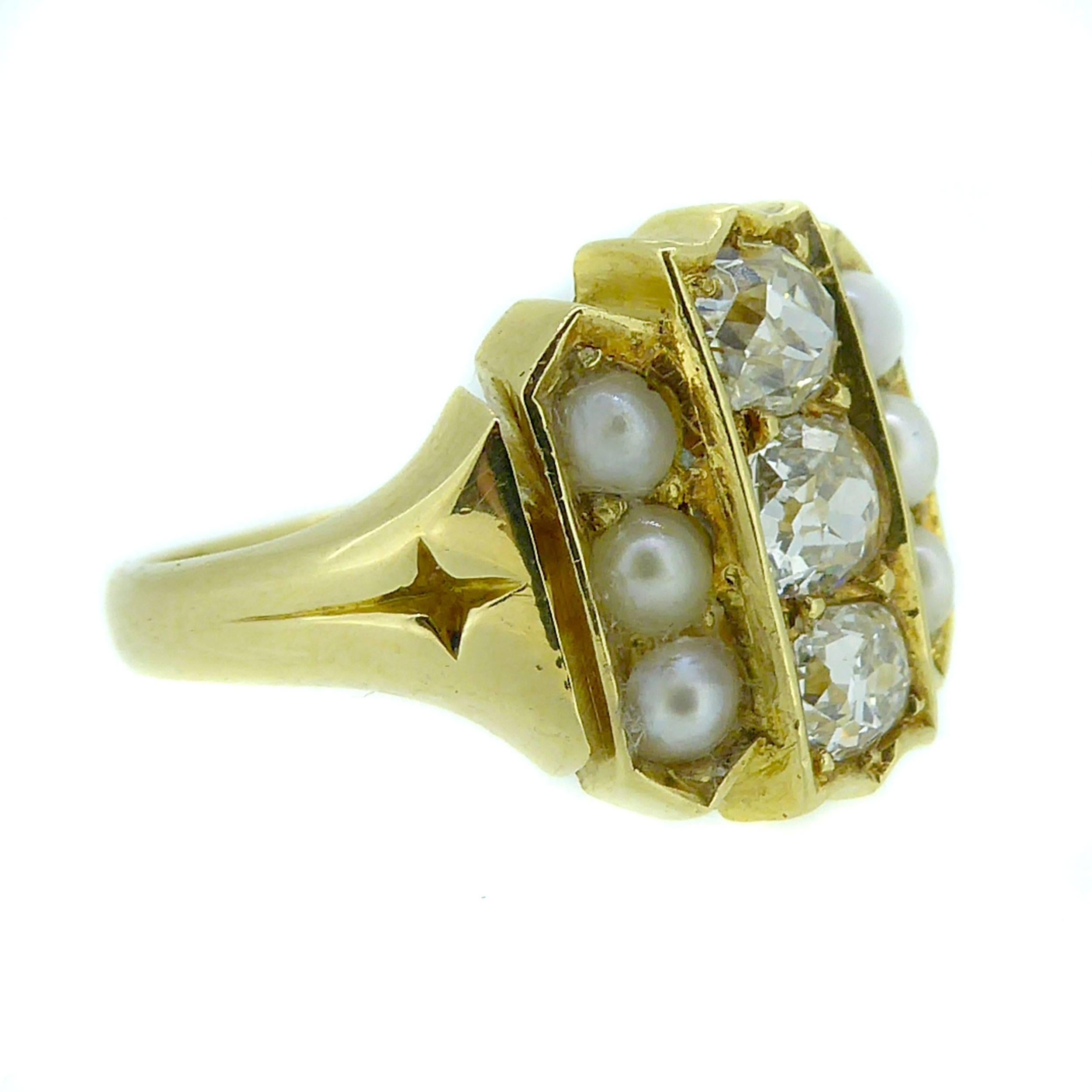 An antique diamond and pearl ring with a difference having a central row of carre set old mine cut diamonds in a yellow gold channel with crown pointed terminals.  

To each side is a rose of round split pearls of creamy white colour grain set in