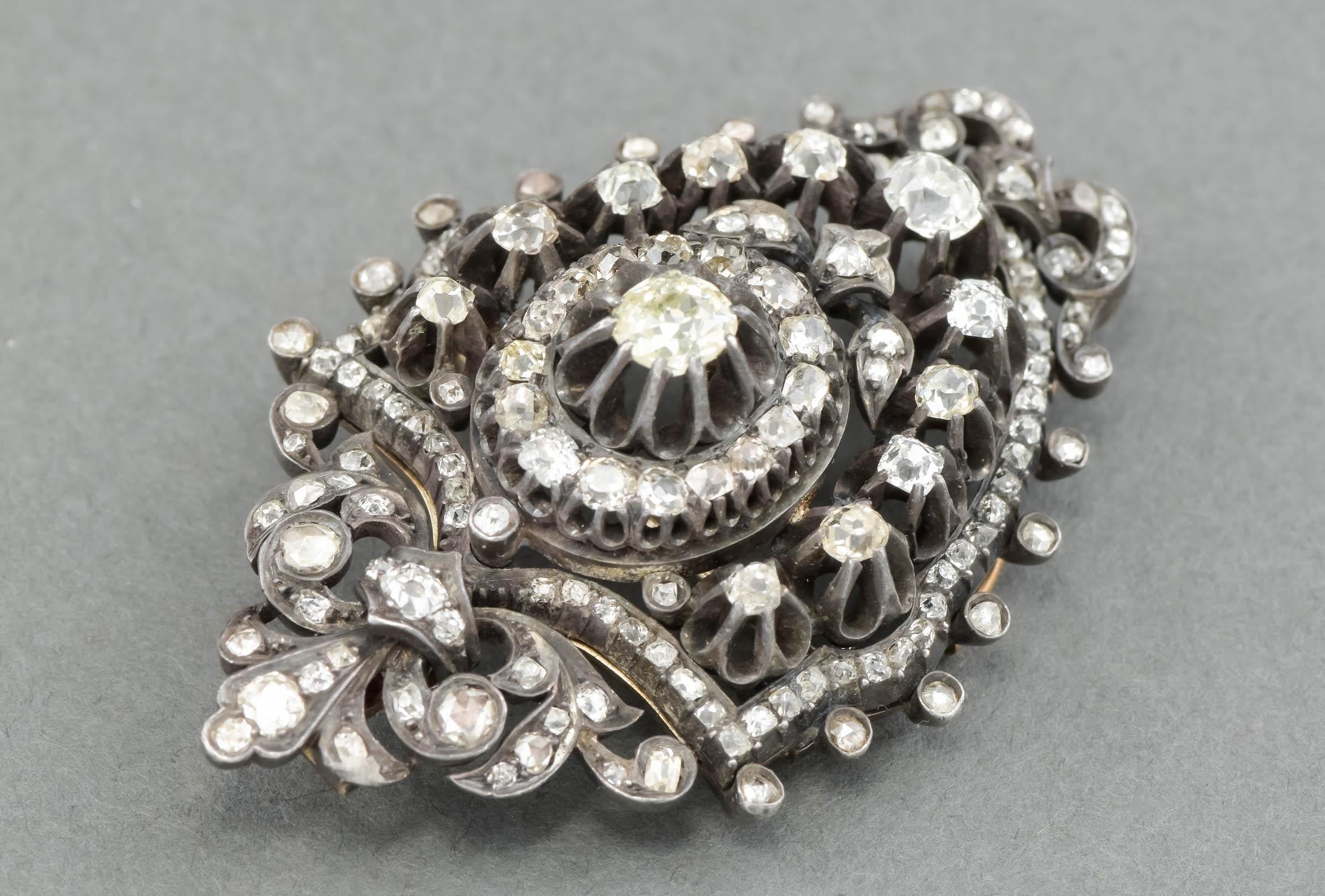 Absolutely gorgeous in person, this glittery antique diamond pendant brooch is very large and special.  I believe it was once part of a larger piece of jewelry dating to the late Georgian to early Victorian period.

Crafted of silver and gold