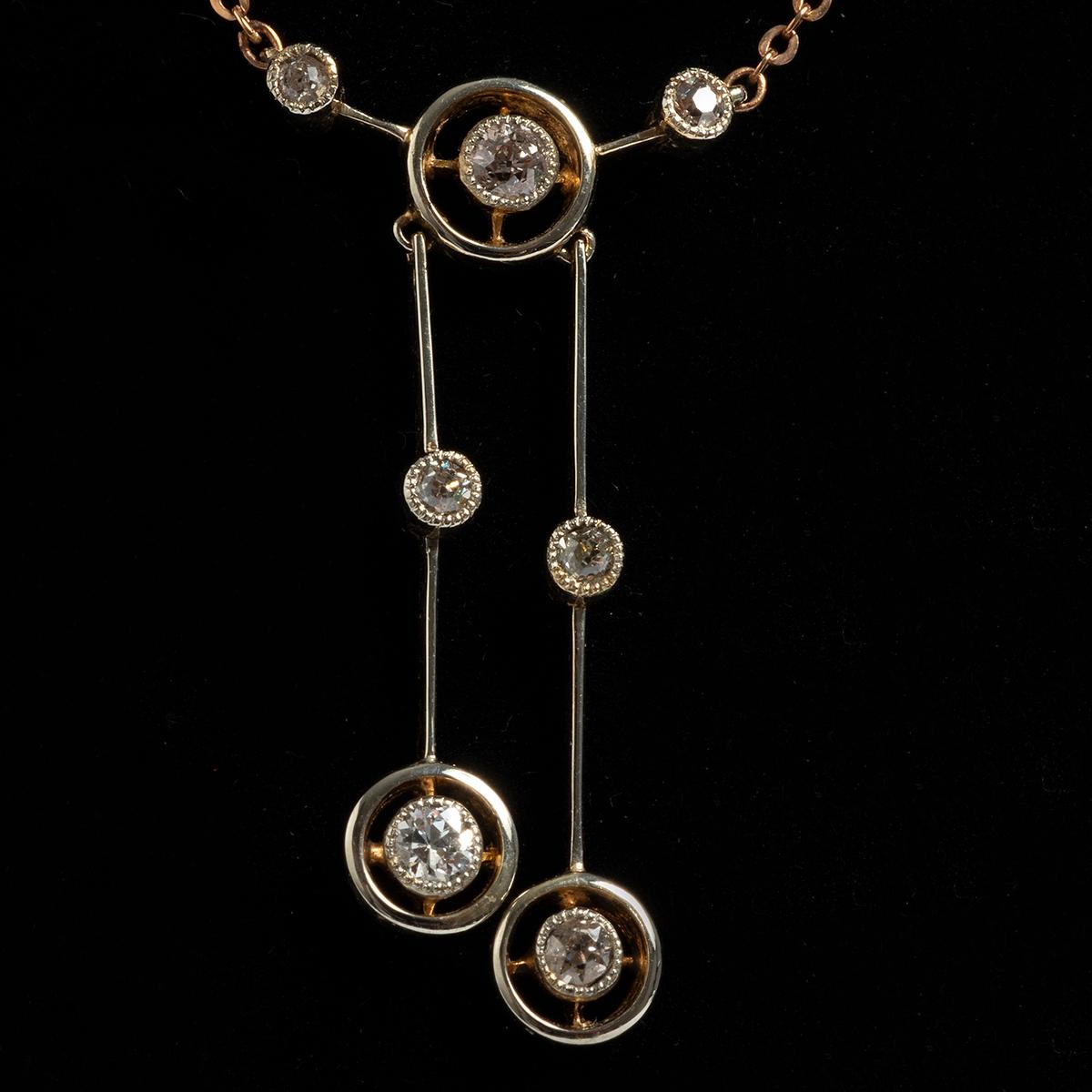 A unique piece within our carefully curated Vintage & Prestige fine jewellery collection, we are delighted to present the following: 
This pretty antique diamond pendant and chain is from 1900's. Set in 18K Yellow Gold with seven diamonds the