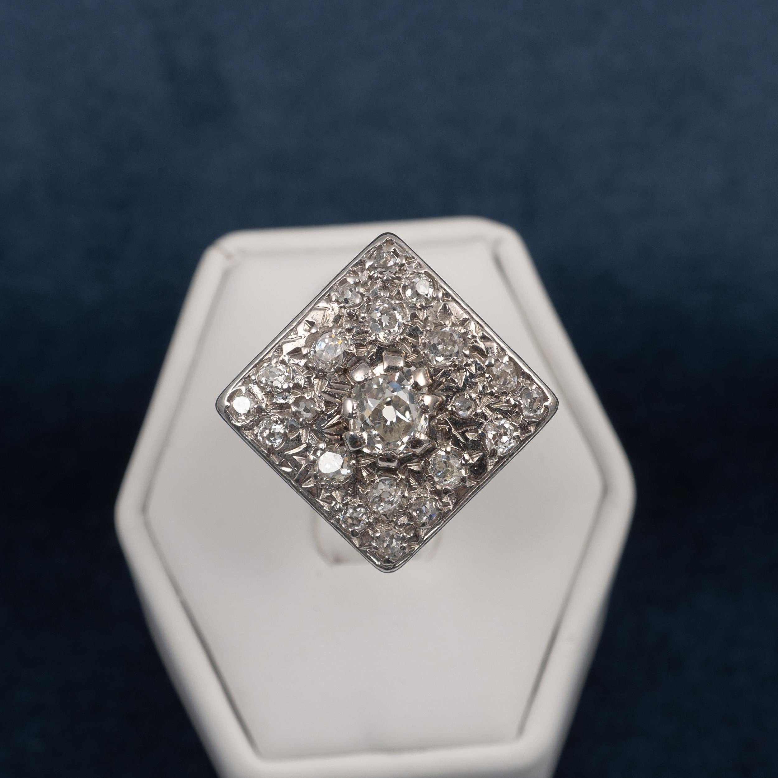 This Art Deco diamond ring is sure to gain plenty of attention. The statement ring is adorned with approx 1.10 carats of old cut diamonds which have beautiful clarity and natural sparkle.

The ring features a centrally set old cut diamond of approx.