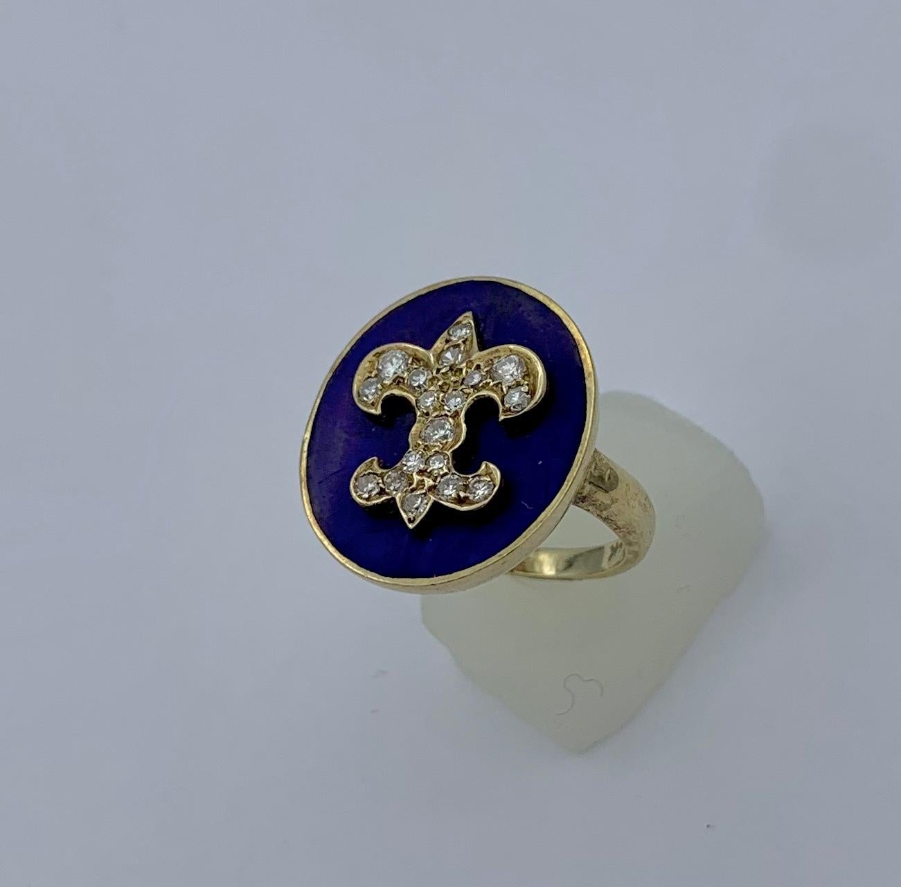 This is an absolutely stunning Antique Victorian Ring with a Diamond Fleurs-de-lis on a Royal Blue Enamel background in 14 Karat gold.  The sparkling white antique diamonds create the wonderful Fleurs-de-lis design.  The royal blue enamel background