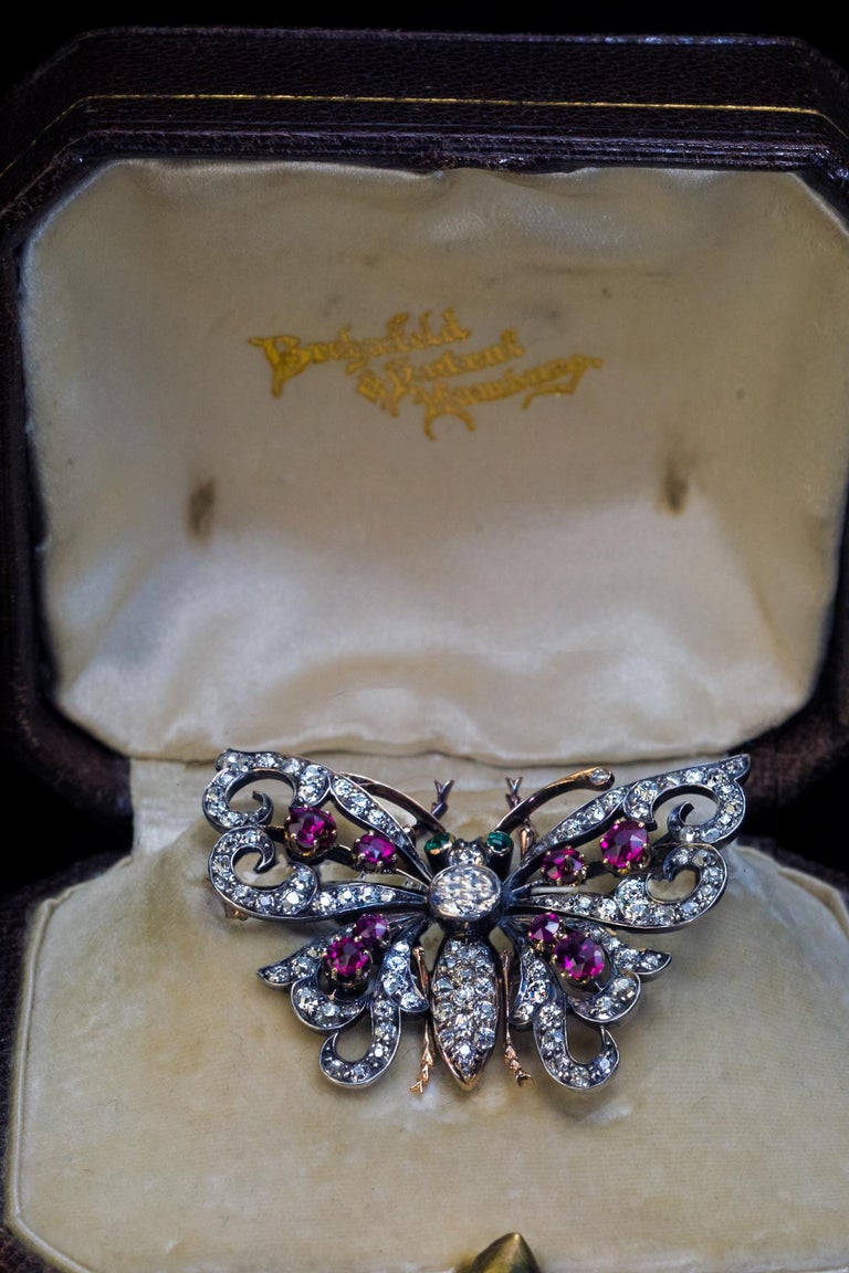 Germany, c.1900

The finely modeled butterfly brooch is handcrafted in silver and 14K gold. The brooch is embellished with bright white old European and old mine cut diamonds, rubies and emeralds.

Estimated total diamond weight is 2.50 carats. The