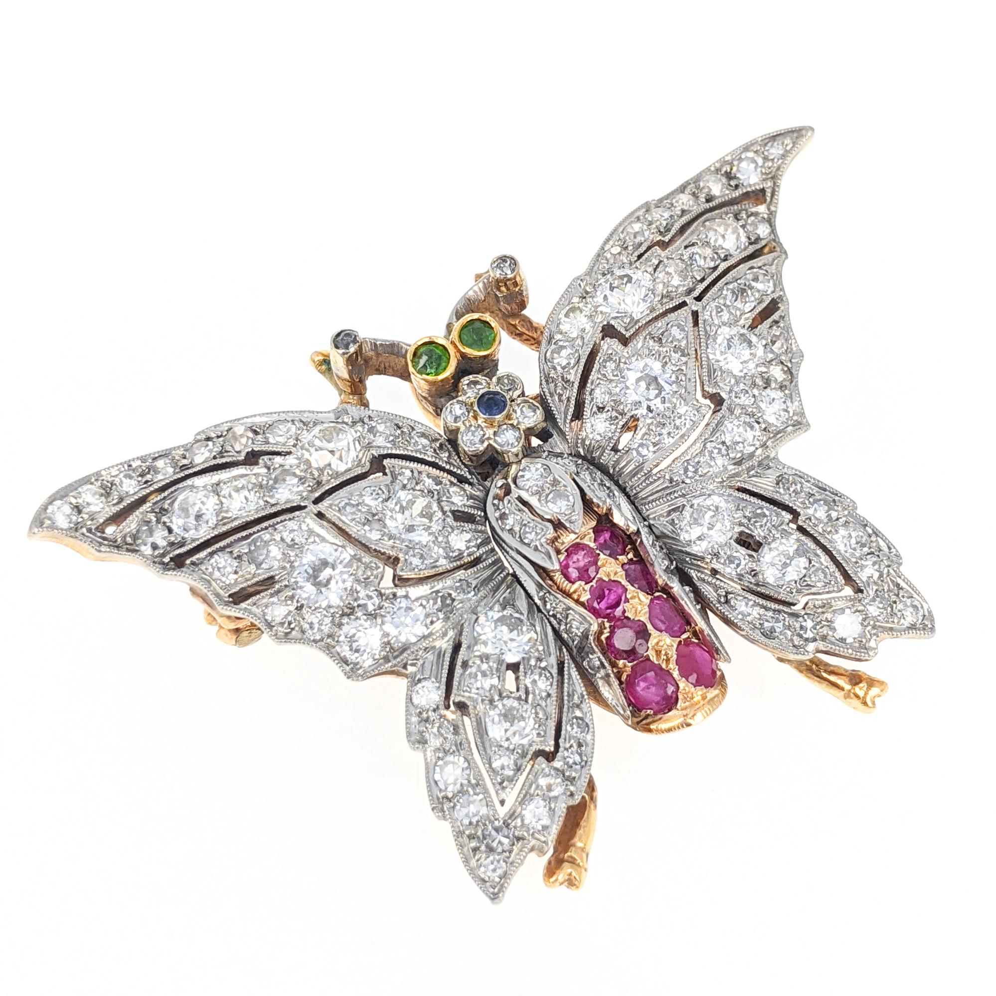 This antique butterfly brooch features 121 Old-European and single-cut diamonds with a total approximate weight of 4.5 carats. The body is further set with eight rubies, one blue stone and the eyes are set with two green stones. It is expertly