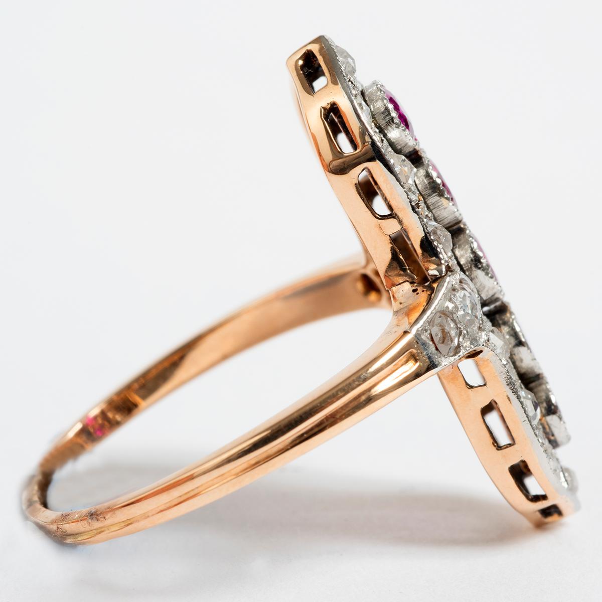 This beautifully designed antique diamond ring is dated early 1900's and comes in UK size R / US size 8.75. This ring consists of diamonds and 5 rubies set in 15K Yellow Gold. An elegant piece and a perfect example of beauty from the era. 